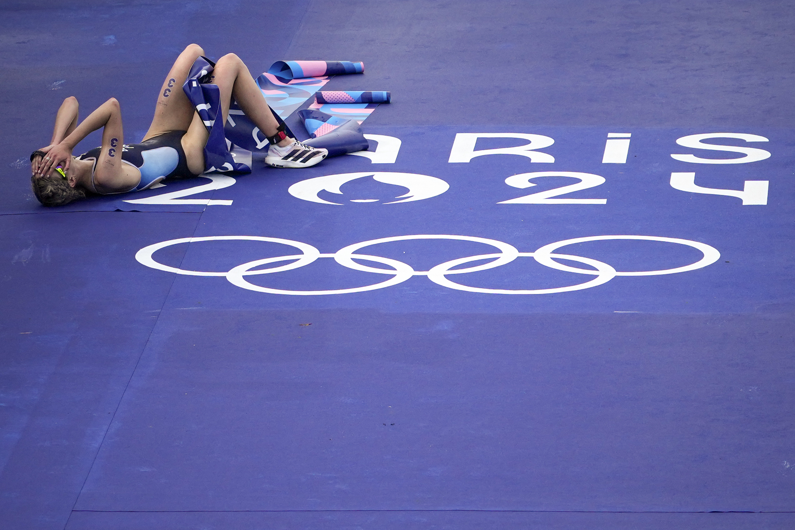 France's Cassandre Beaugrand celebrates after winning the gold medal at the end of the women's individual triathlon competition at the 2024 Summer Olympics, Wednesday, July 31, 2024, in Paris, France.