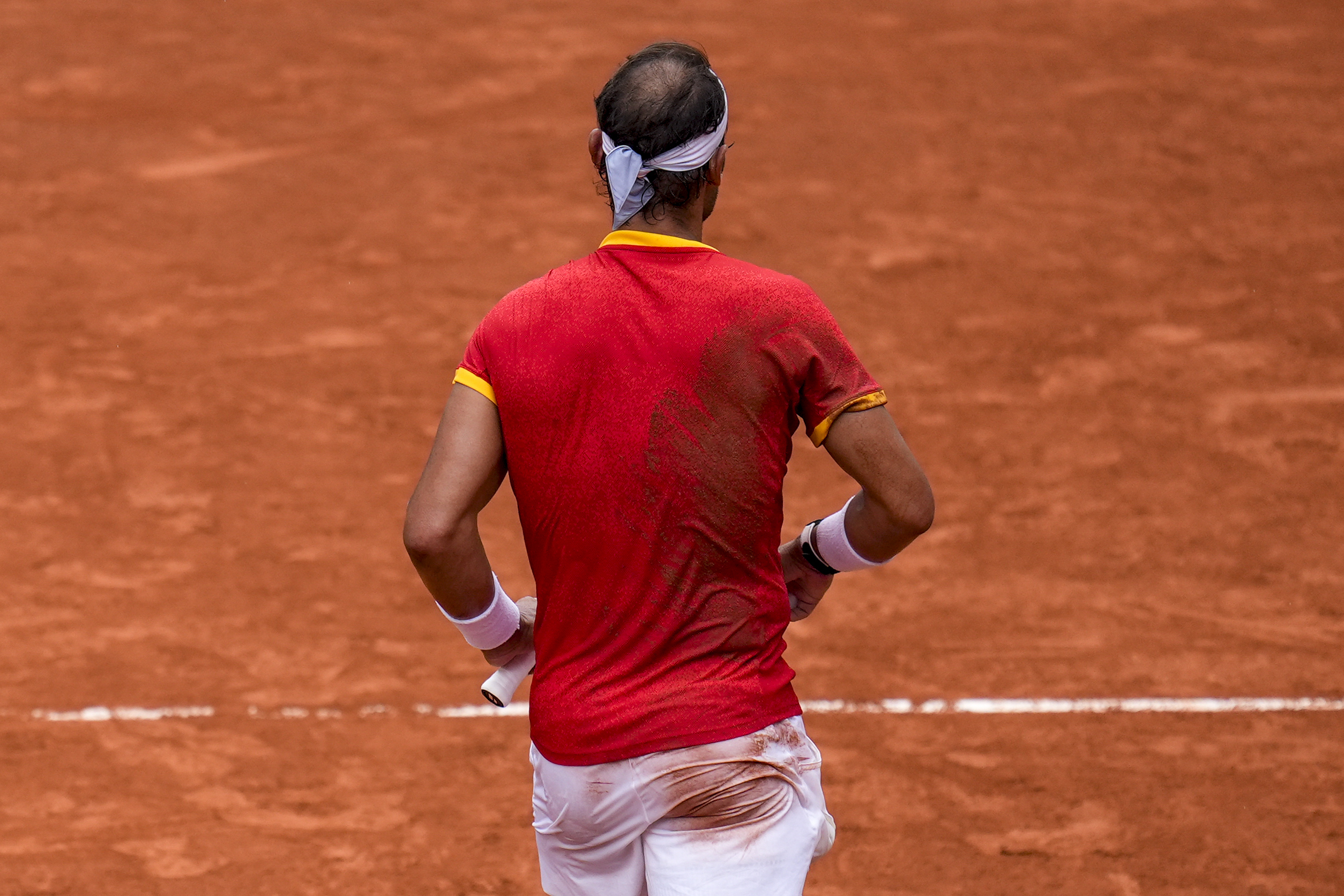 Rafael Nadal of Spain during his match with his teammate Carlos Alcaraz against Tallon Griekspoor and Wesley Koolhof of the Netherlands during the men's doubles tennis competition at the Roland Garros stadium, at the 2024 Summer Olympics, Tuesday, July 30, 2024, in Paris, France. 