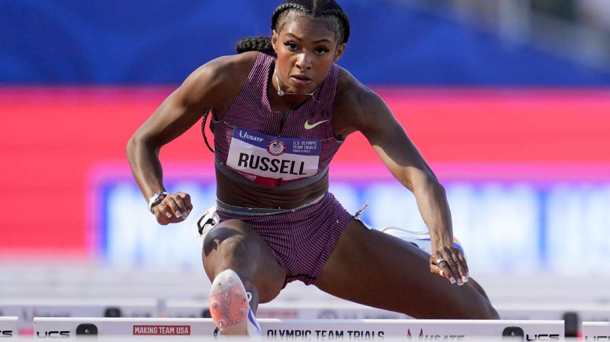 FILE - Masai Russell wins a heat women's 100-meter hurdles during the U.S. Track and Field Olympic Team Trials Friday, June 28, 2024, in Eugene, Ore.