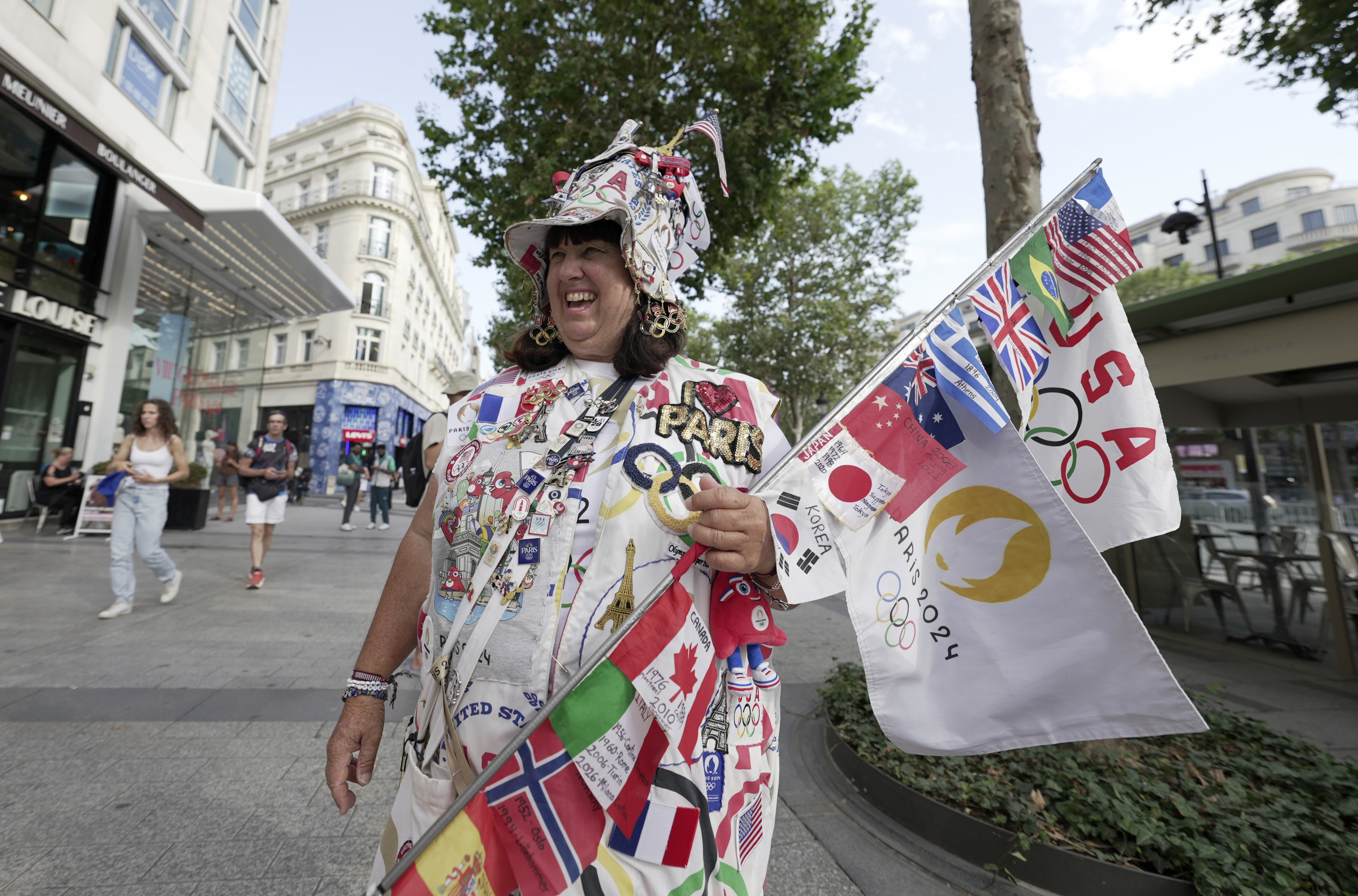 Vivianne Robinson poses a photo, during 2024 Summer Olympics, in Paris, France, Tuesday, July 30, 2024. The Olympics superfan has attended seven Games over the span of 40 years. 