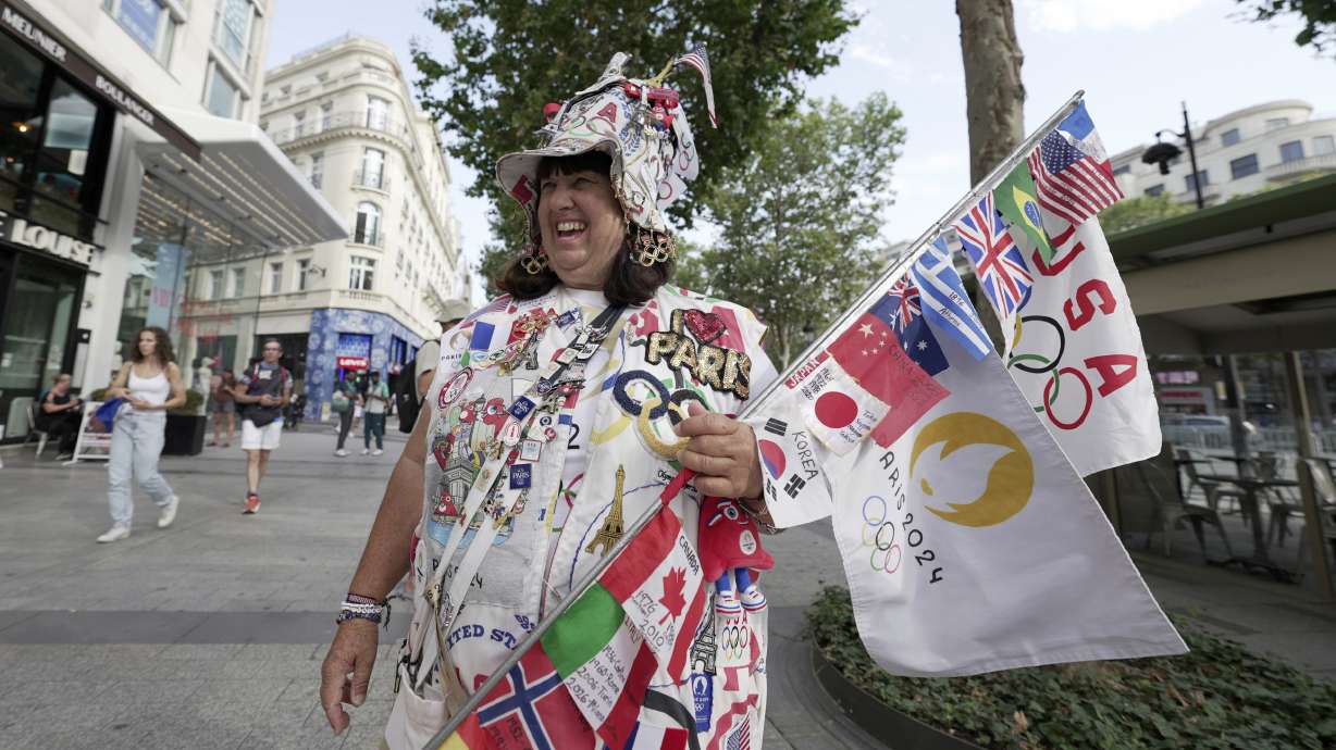 Vivianne Robinson poses a photo, during 2024 Summer Olympics, in Paris, France, Tuesday, July 30, 2024. The Olympics superfan has attended seven Games over the span of 40 years.