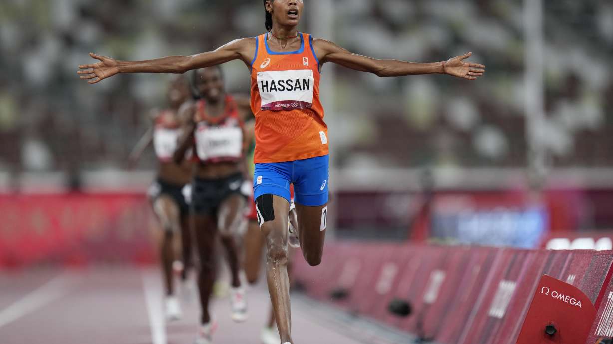 FILE - Sifan Hassan, of the Netherlands, celebrates as she crosses the finish line to win the women's 5,000-meters final at the 2020 Summer Olympics, Monday, Aug. 2, 2021, in Tokyo.