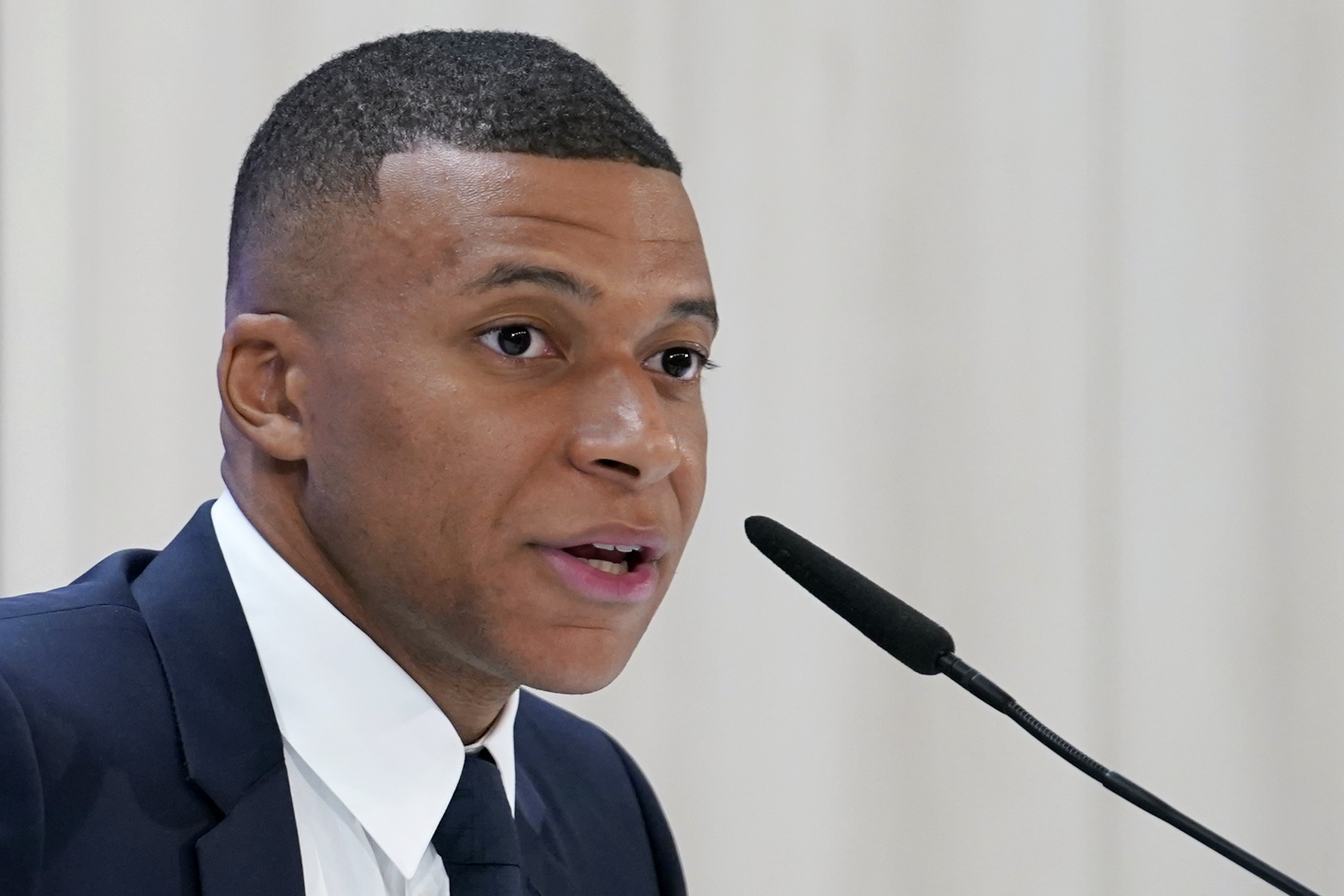Kylian Mbappe, of France, speaks during a news conference after being presented to fans as a new Real Madrid player at the Santiago Bernabeu stadium in Madrid, Tuesday, July 16, 2024. 