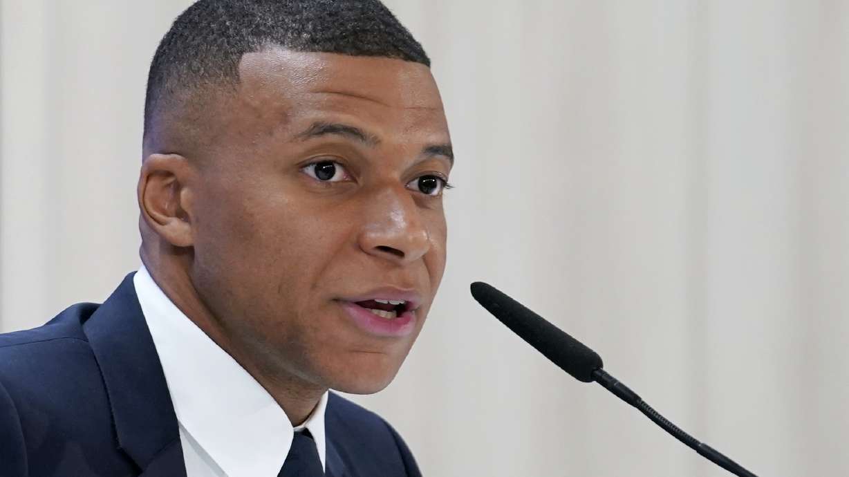 Kylian Mbappe, of France, speaks during a news conference after being presented to fans as a new Real Madrid player at the Santiago Bernabeu stadium in Madrid, Tuesday, July 16, 2024.
