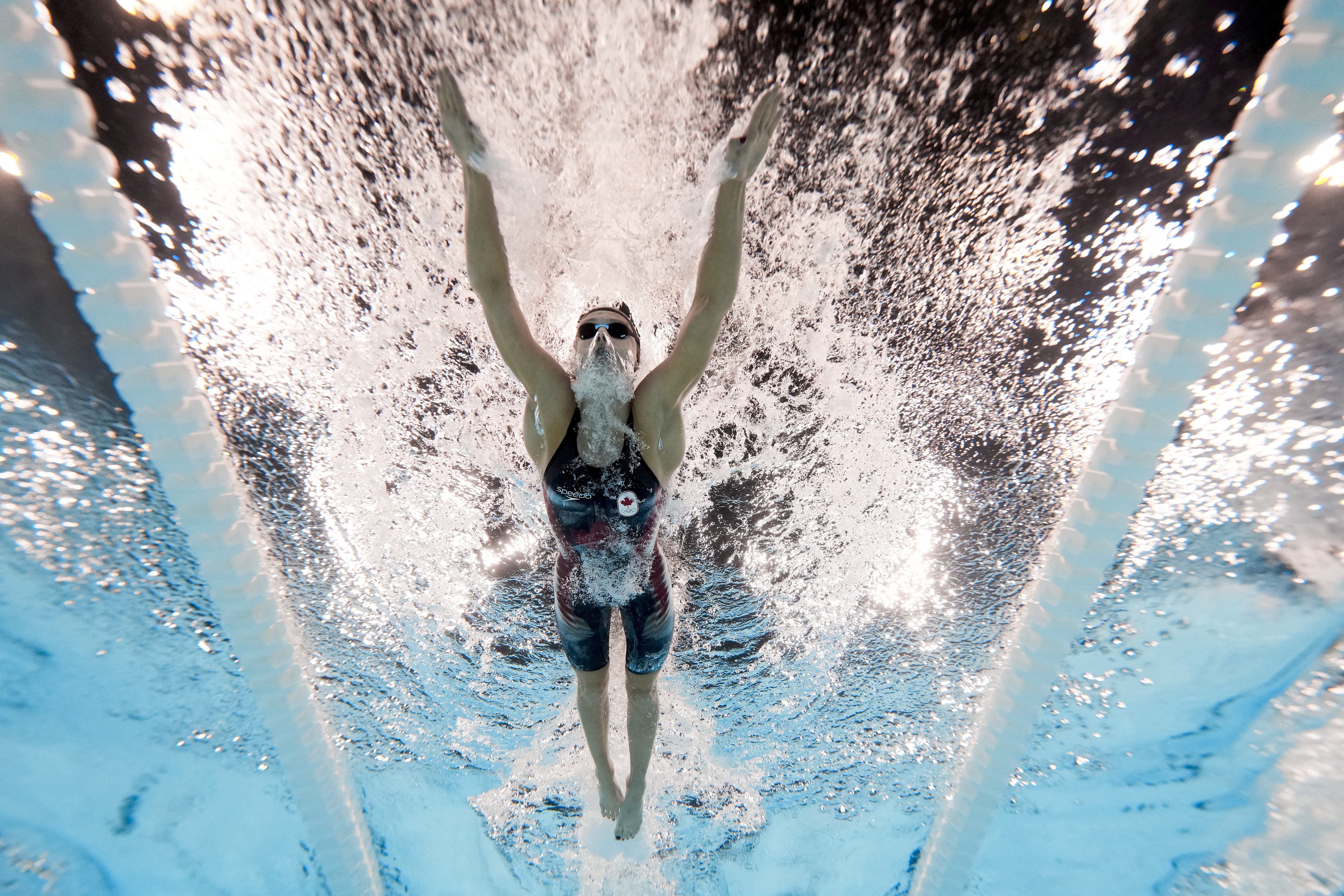 Summer McIntosh, of Canada, competes during a heat in the women's 200-meter butterfly at the 2024 Summer Olympics, Wednesday, July 31, 2024, in Nanterre, France. 