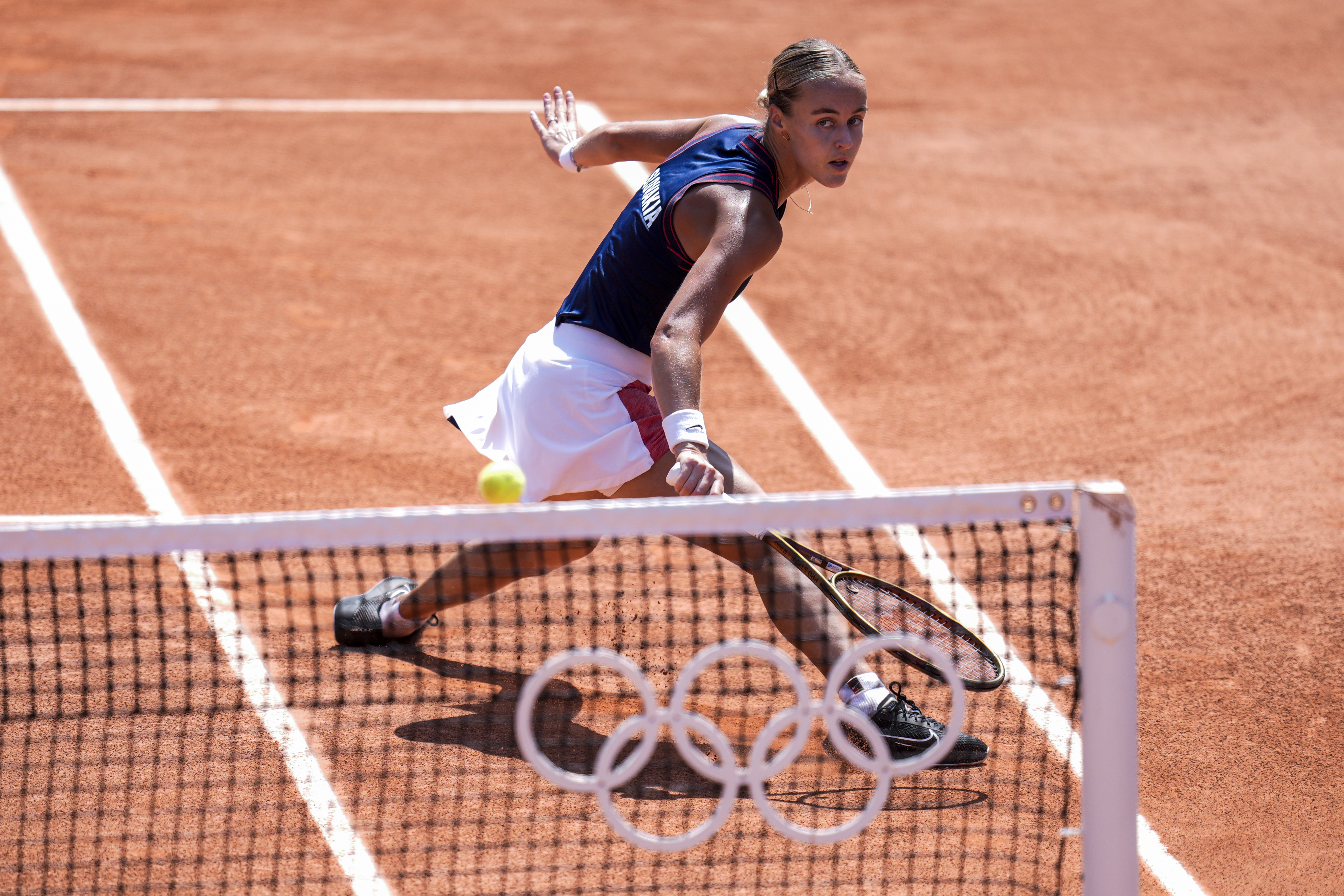 Anna Karolina Schmiedlova of Slovakia returns the ball against Barbora Krejcikova of Czech Republic during the women's single tennis competition at the Roland Garros stadium, at the 2024 Summer Olympics, Wednesday, July 31, 2024, in Paris, France. 