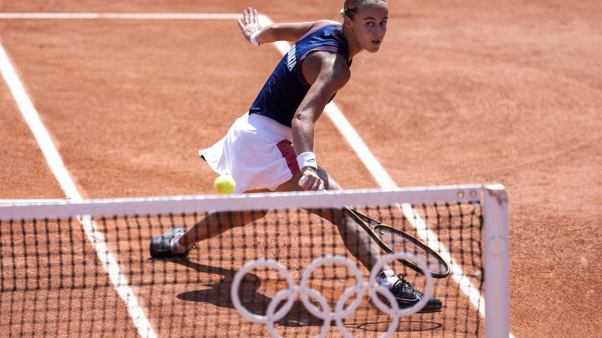 Anna Karolina Schmiedlova of Slovakia returns the ball against Barbora Krejcikova of Czech Republic during the women's single tennis competition at the Roland Garros stadium, at the 2024 Summer Olympics, Wednesday, July 31, 2024, in Paris, France.