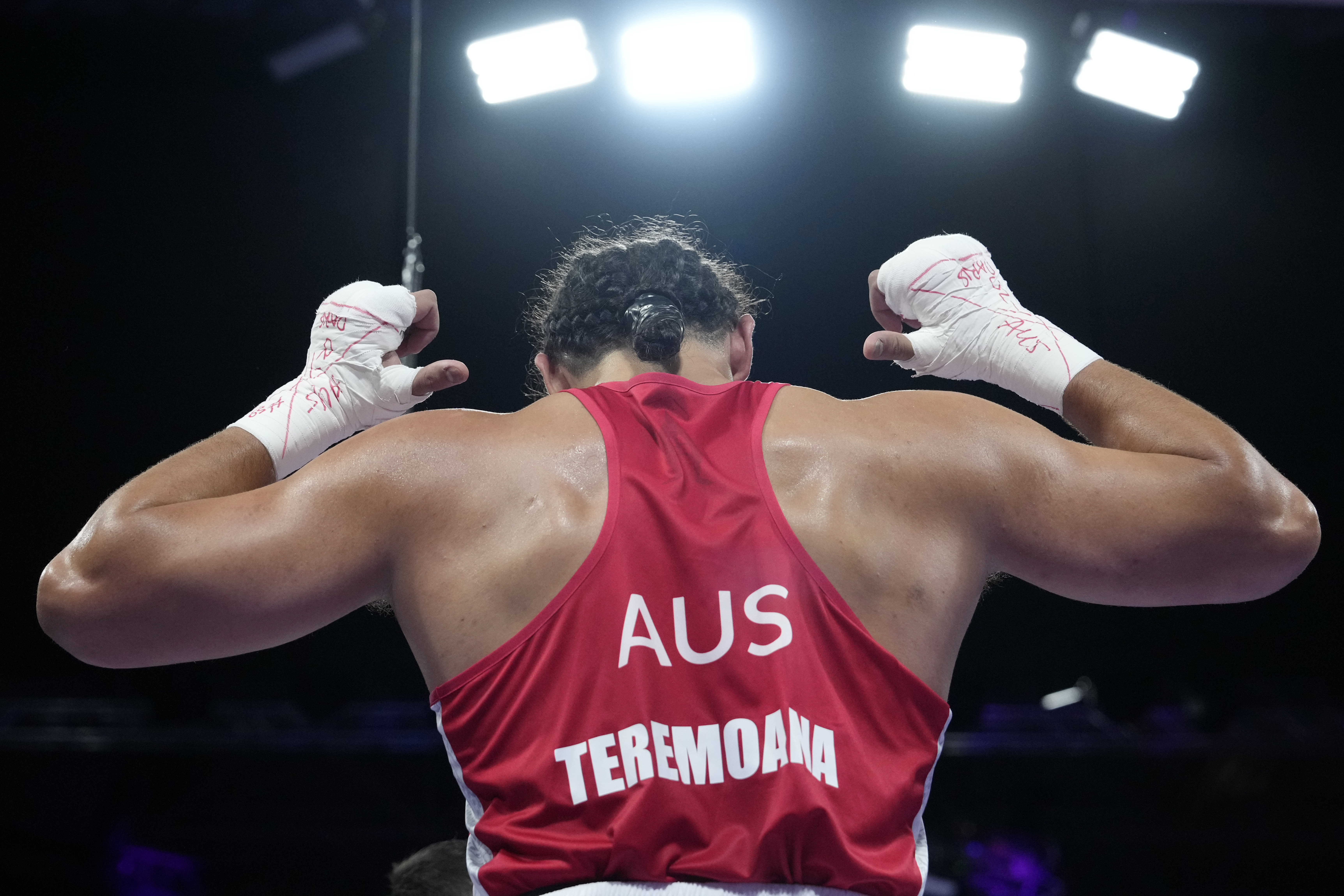 Australia's Teremoana Teremoana celebrates after defeating Ukraine's Dmytro Lovchynskyi in their men's +92 kg preliminary boxing match at the 2024 Summer Olympics, Monday, July 29, 2024, in Paris, France. 