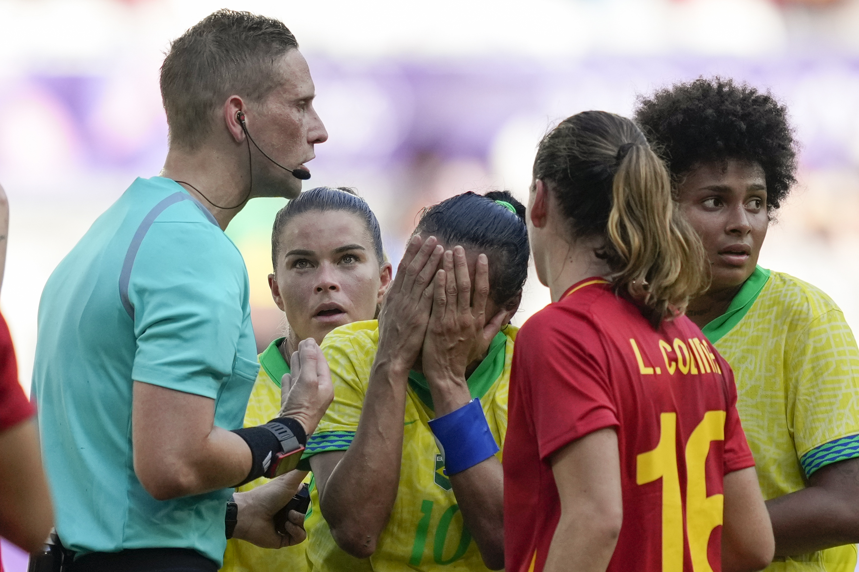 Brazil's Marta, center, reacts after receiving a red card from referee Espen Eskas during a women's Group C soccer match between Brazil and Spain, at Bordeaux Stadium, during the 2024 Summer Olympics, Wednesday, July 31, 2024, in Bordeaux, France.