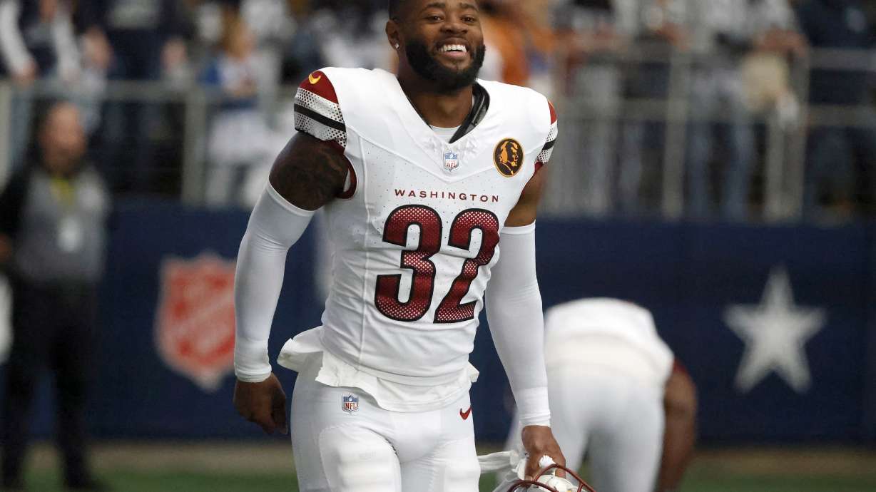 FILE - Washington Commanders safety Terrell Burgess (32) walks on the field prior to an NFL Football game in Arlington, Texas, Sunday, Nov. 23, 2023. The Buffalo Bills shored up an injury depleted and offseason retooled position by signing Burgess to a one-year contract, Wednesday, July 31, 2024.