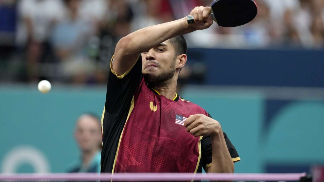 United States' Kanak Jha plays against Greece's Panagiotis Gionis during a men's singles round of 32 table tennis game at the 2024 Summer Olympics, Wednesday, July 31, 2024, in Paris, France.