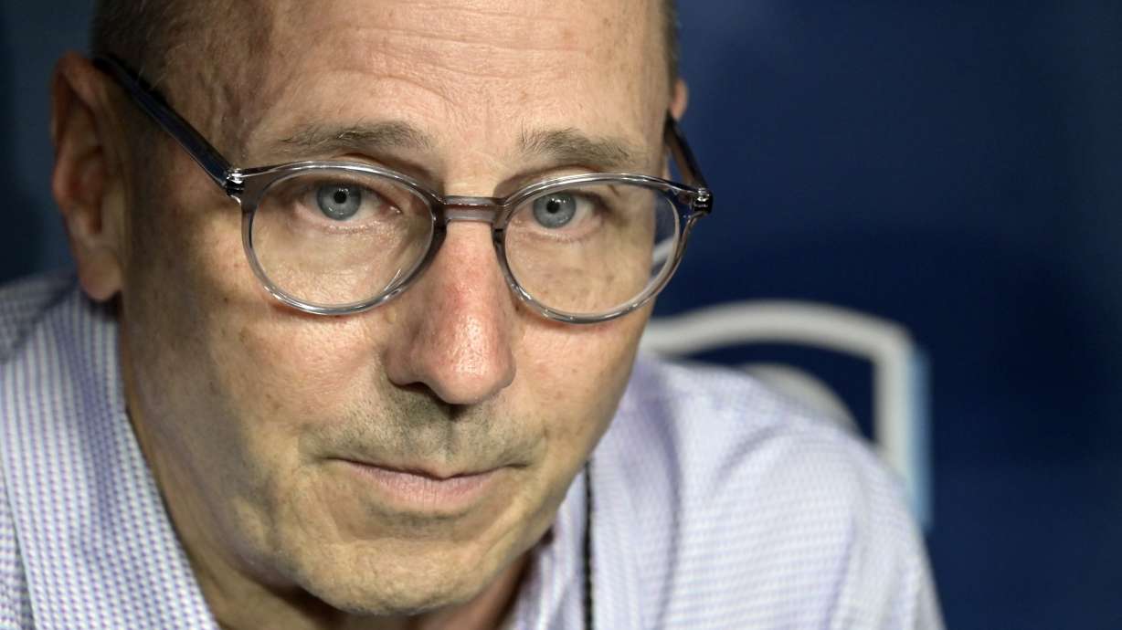 New York Yankees general manager Brian Cashman meets with reporters in the dugout before a baseball game against the Tampa Bay Rays, Tuesday, July 9, 2024, in St. Petersburg, Fla.