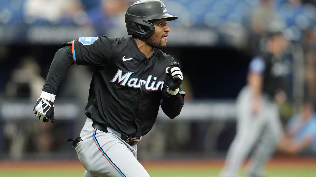 Miami Marlins' Xavier Edwards runs to first after his two-run single off Tampa Bay Rays relief pitcher Edwin Uceta during the seventh inning of a baseball game Wednesday, July 31, 2024, in St. Petersburg, Fla.