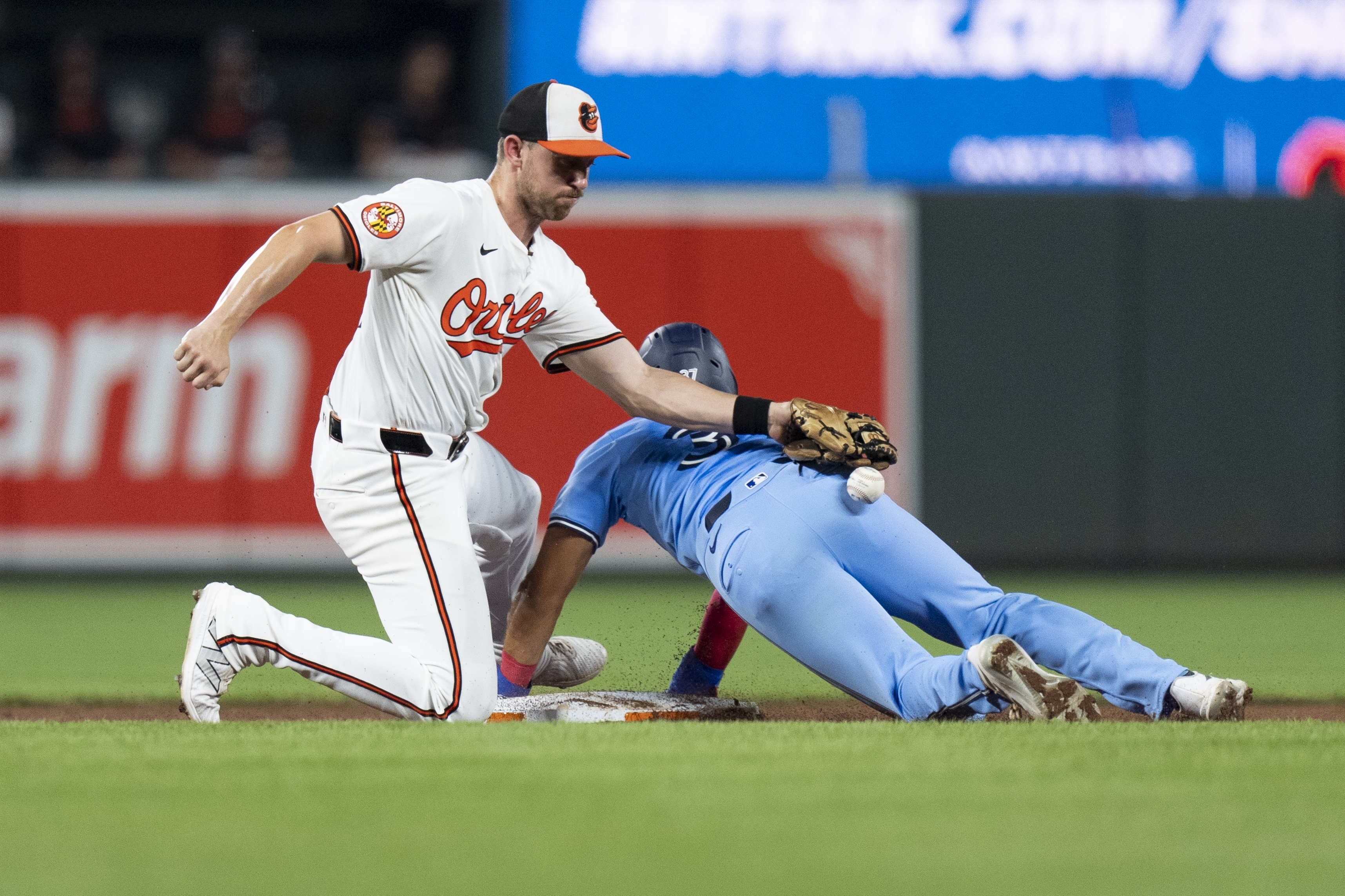 Toronto Blue Jays' Steward Berroa, right, steals second base in front of Baltimore Orioles second baseman Jordan Westburg, left, during the seventh inning of a baseball game, Tuesday, July 30, 2024, in Baltimore. 