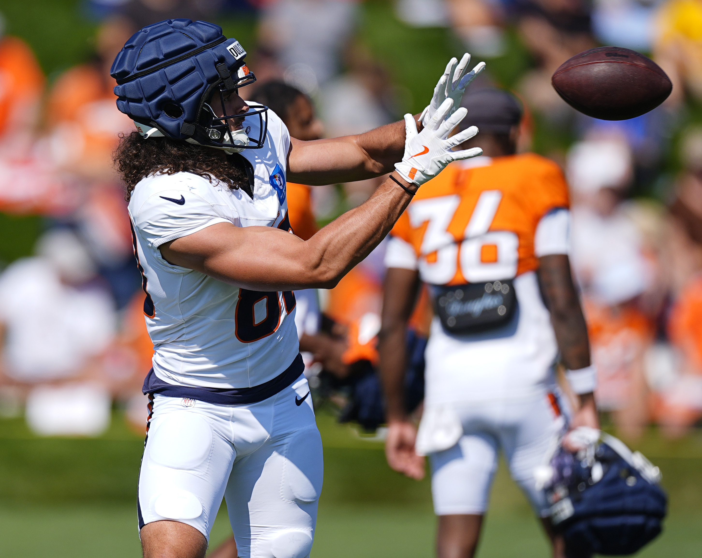 Denver Broncos tight end Greg Dulcich takes part in drills during NFL football training camp Wednesday, July 31, 2024, at the team's headquarters in Centennial, Colo. 