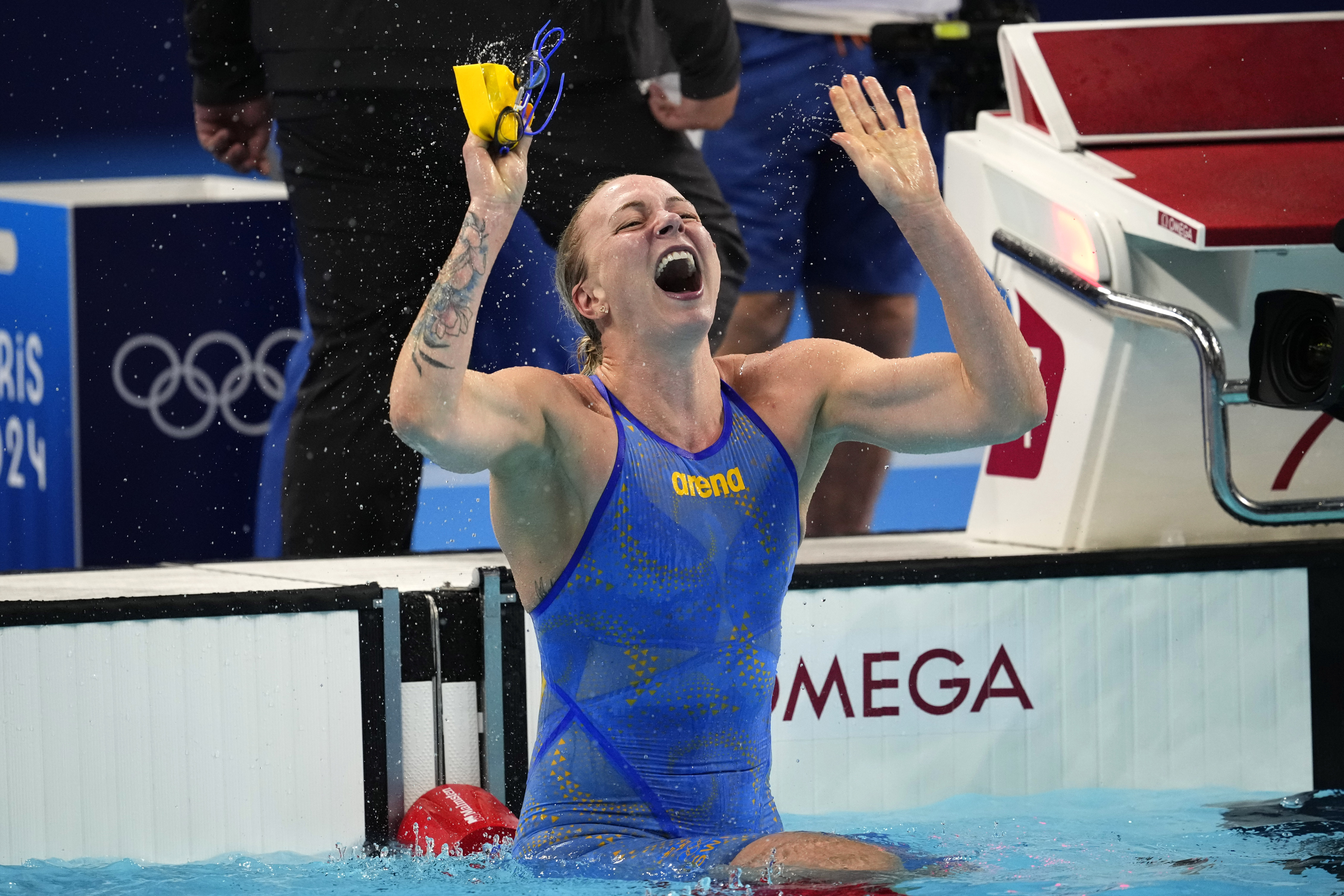 Sarah Sjoestroem, of Sweden, celebrates after winning the women's 100-meter freestyle final at the 2024 Summer Olympics, Wednesday, July 31, 2024, in Nanterre, France.