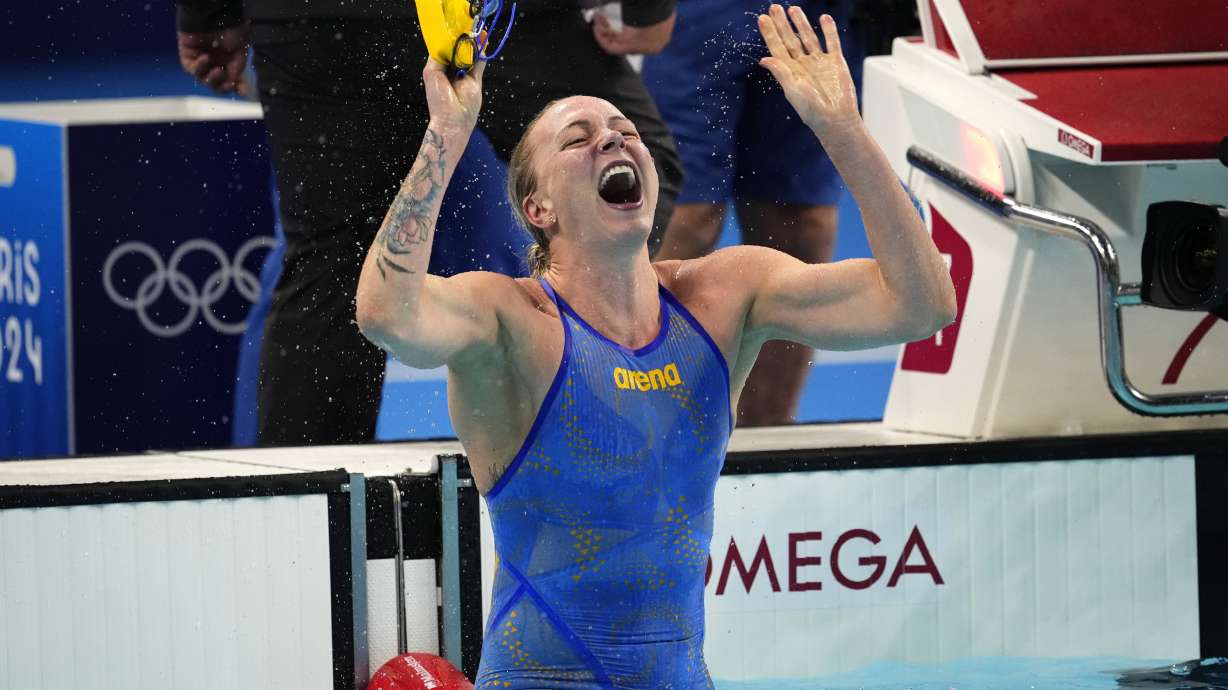 Sarah Sjoestroem, of Sweden, celebrates after winning the women's 100-meter freestyle final at the 2024 Summer Olympics, Wednesday, July 31, 2024, in Nanterre, France.