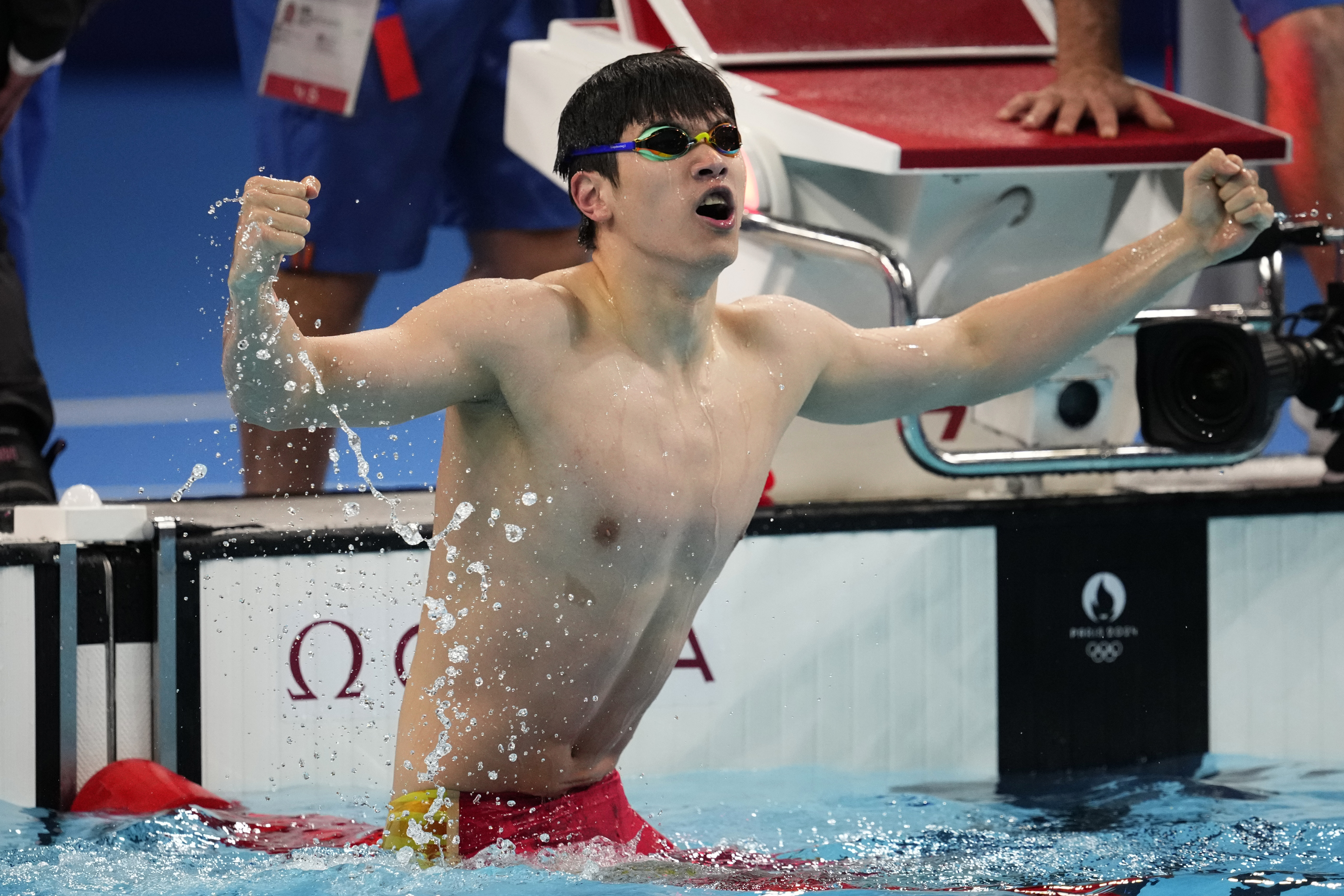 Pan Zhanle, of China, celebrates after winning the men's 100-meter freestyle final at the 2024 Summer Olympics, Wednesday, July 31, 2024, in Nanterre, France. 