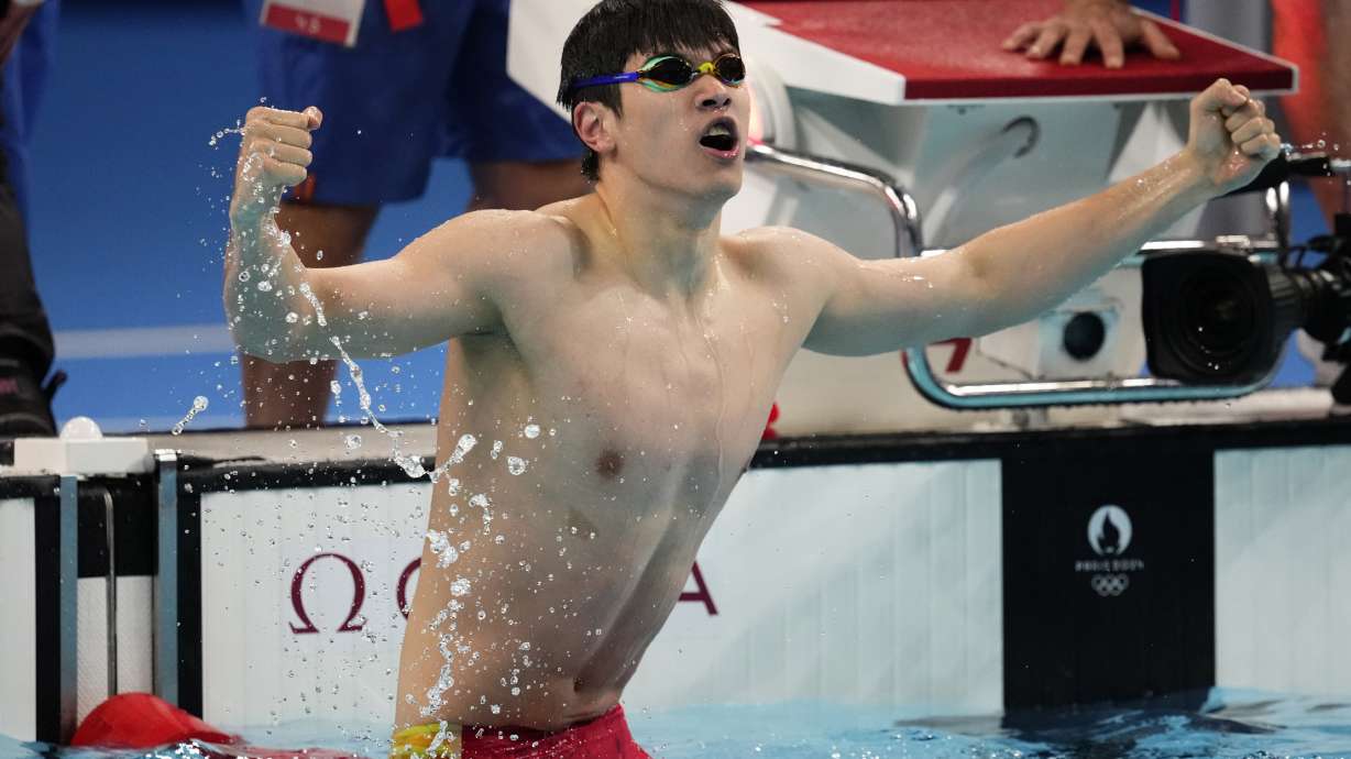Pan Zhanle, of China, celebrates after winning the men's 100-meter freestyle final at the 2024 Summer Olympics, Wednesday, July 31, 2024, in Nanterre, France.