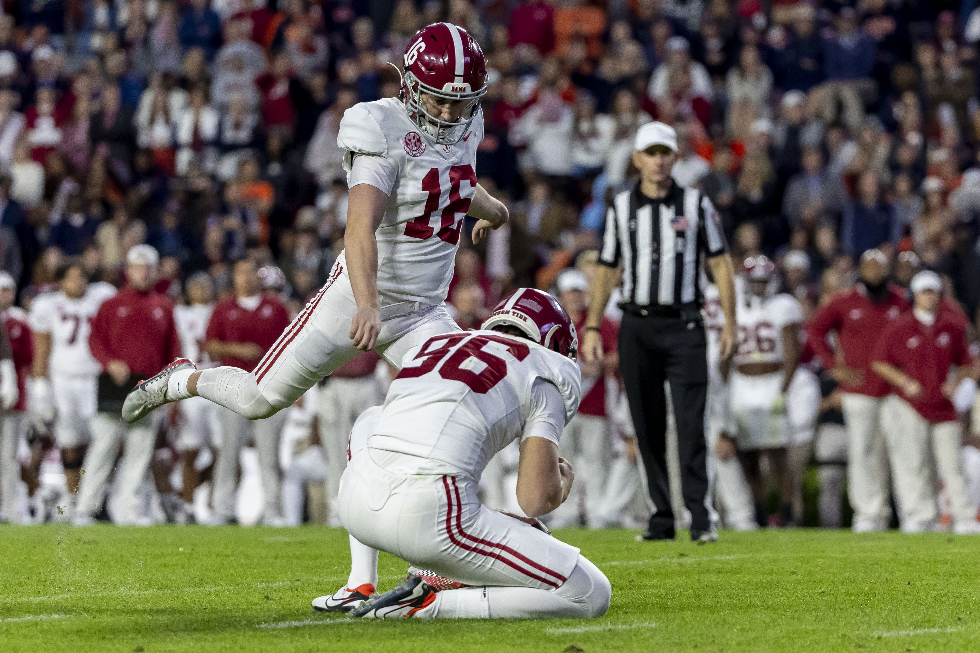 FILE - Alabama kicker Will Reichard (16) kicks a 22-yard field goal during the second half of an NCAA college football game against Auburn, Saturday, Nov. 25, 2023, in Auburn, Ala. 