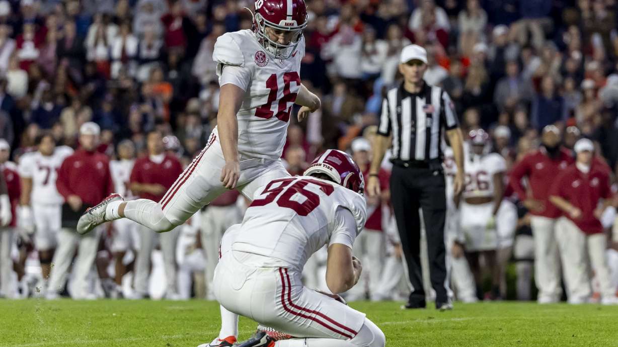 FILE - Alabama kicker Will Reichard (16) kicks a 22-yard field goal during the second half of an NCAA college football game against Auburn, Saturday, Nov. 25, 2023, in Auburn, Ala.