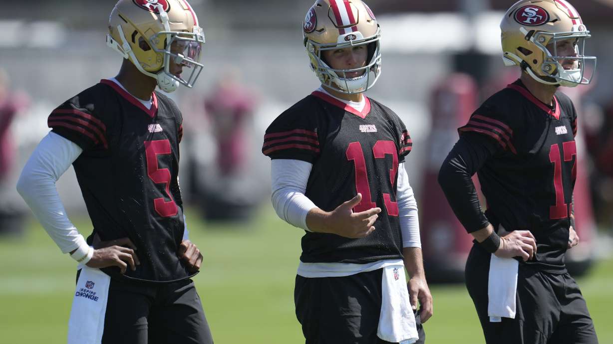 San Francisco 49ers quarterbacks Joshua Dobbs (5), Brock Purdy (13) and Brandon Allen (17) take part in practice during NFL football training camp in Santa Clara, Calif., Thursday, July 25, 2024.