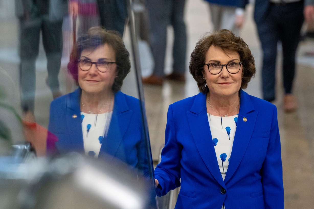 Sen. Jacky Rosen, D-Nev., rides an escalator to a vote on Capitol Hill, Sept. 6, 2023, in Washington.