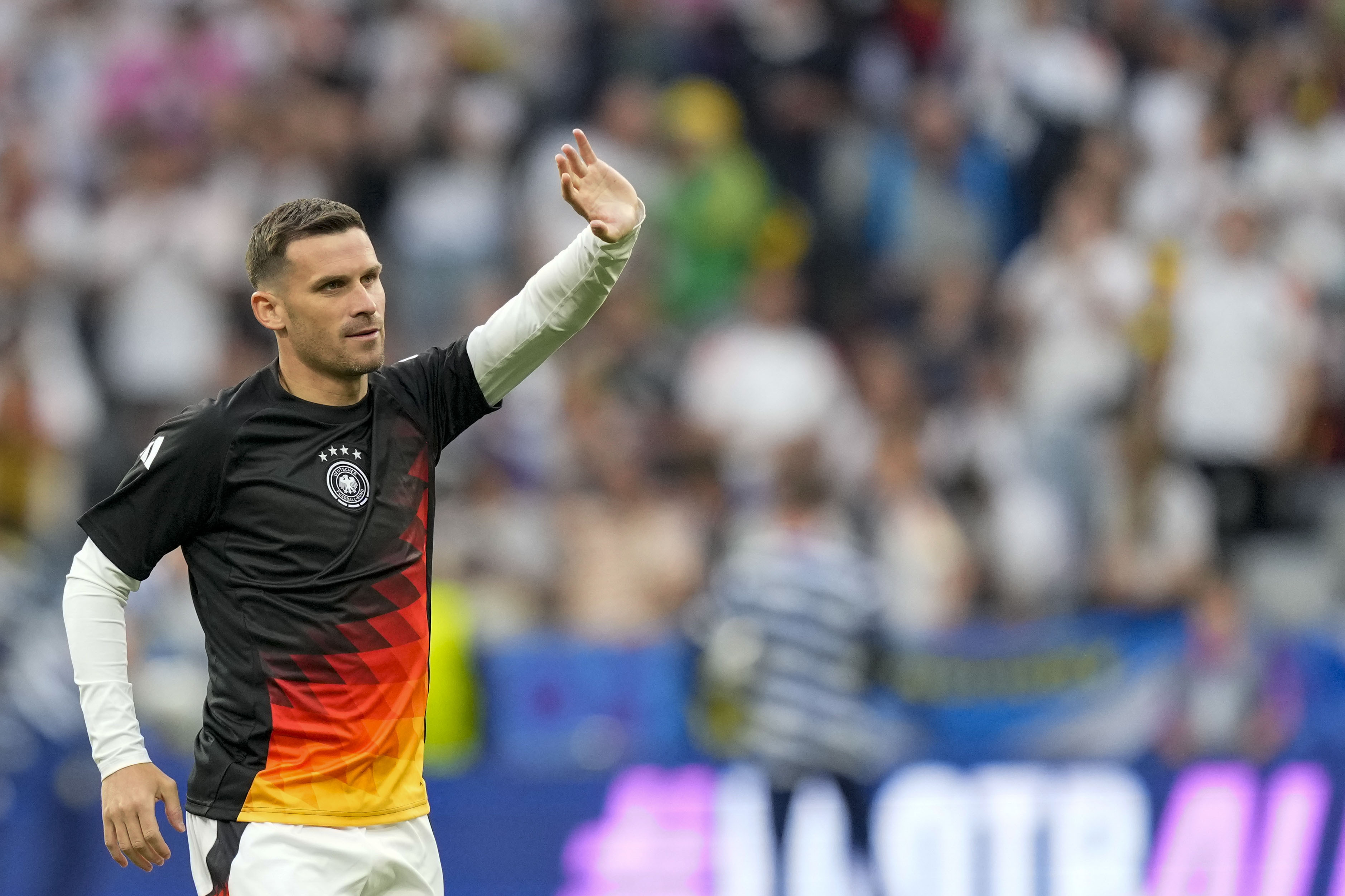 FILE - Germany's Pascal Gross waves to fans during the warm up prior to the Group A match between Germany and Scotland at the Euro 2024 soccer tournament in Munich, Germany, on June 14, 2024. Champions League runner-up Borussia Dortmund signed Gross from Brighton on Thursday, Aug. 1, 2024 adding depth and experience to its midfield. 