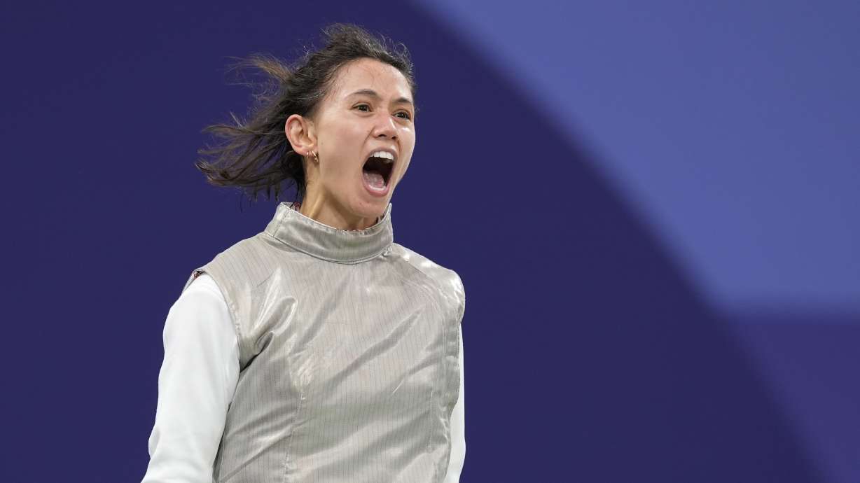 United States' Lee Kiefer reacts as she competes with Canada's Yunjia Zhang in the women's team foil semifinal match during the 2024 Summer Olympics at the Grand Palais, Thursday, Aug. 1, 2024, in Paris, France.