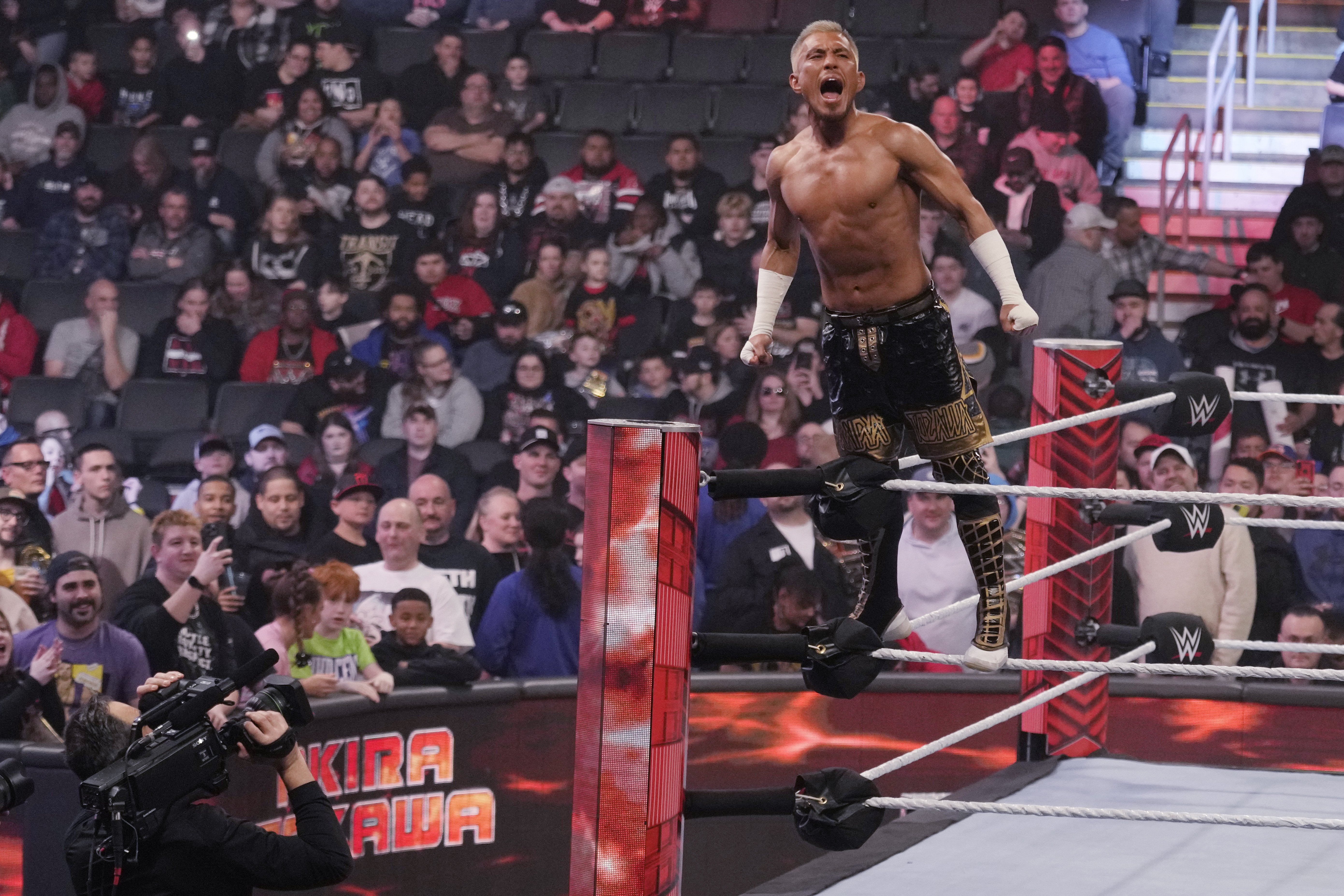 FILE - Wrestler Akira Tozawa is introduced during the WWE Monday Night RAW event, March 6, 2023, in Boston. Just days away, WWE is gearing up for 2024's SummerSlam, which promises to bring lots of action - and sponsorships. 