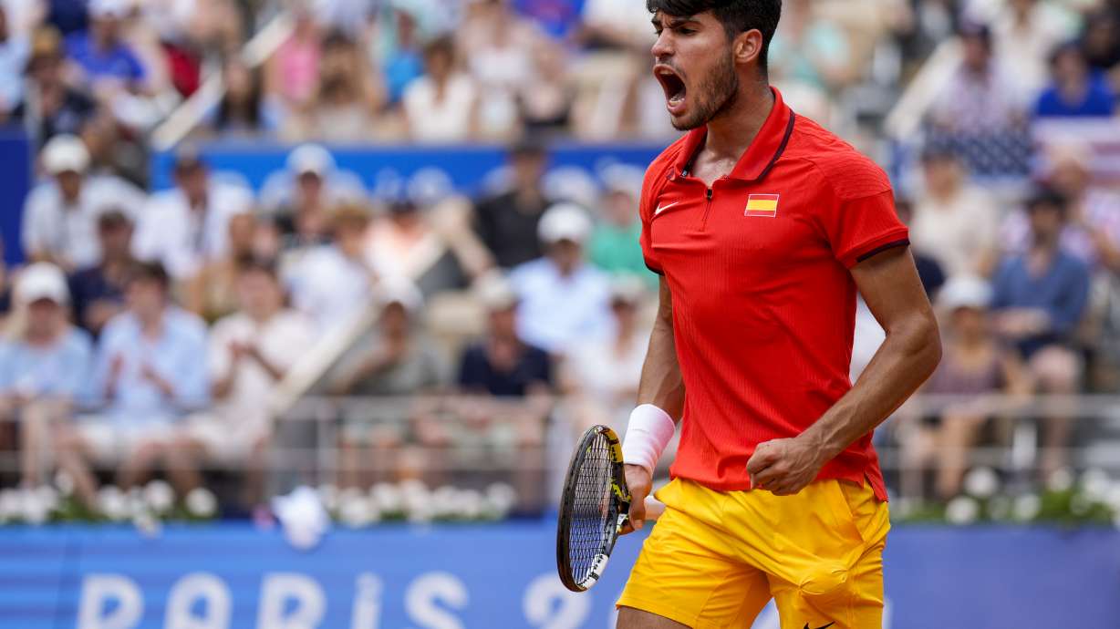 Carlos Alcaraz of Spain celebrates a point against Tommy Paul, of United States during their men's quarter-final match at the Roland Garros stadium, at the 2024 Summer Olympics, Thursday, Aug. 1, 2024, in Paris, France.