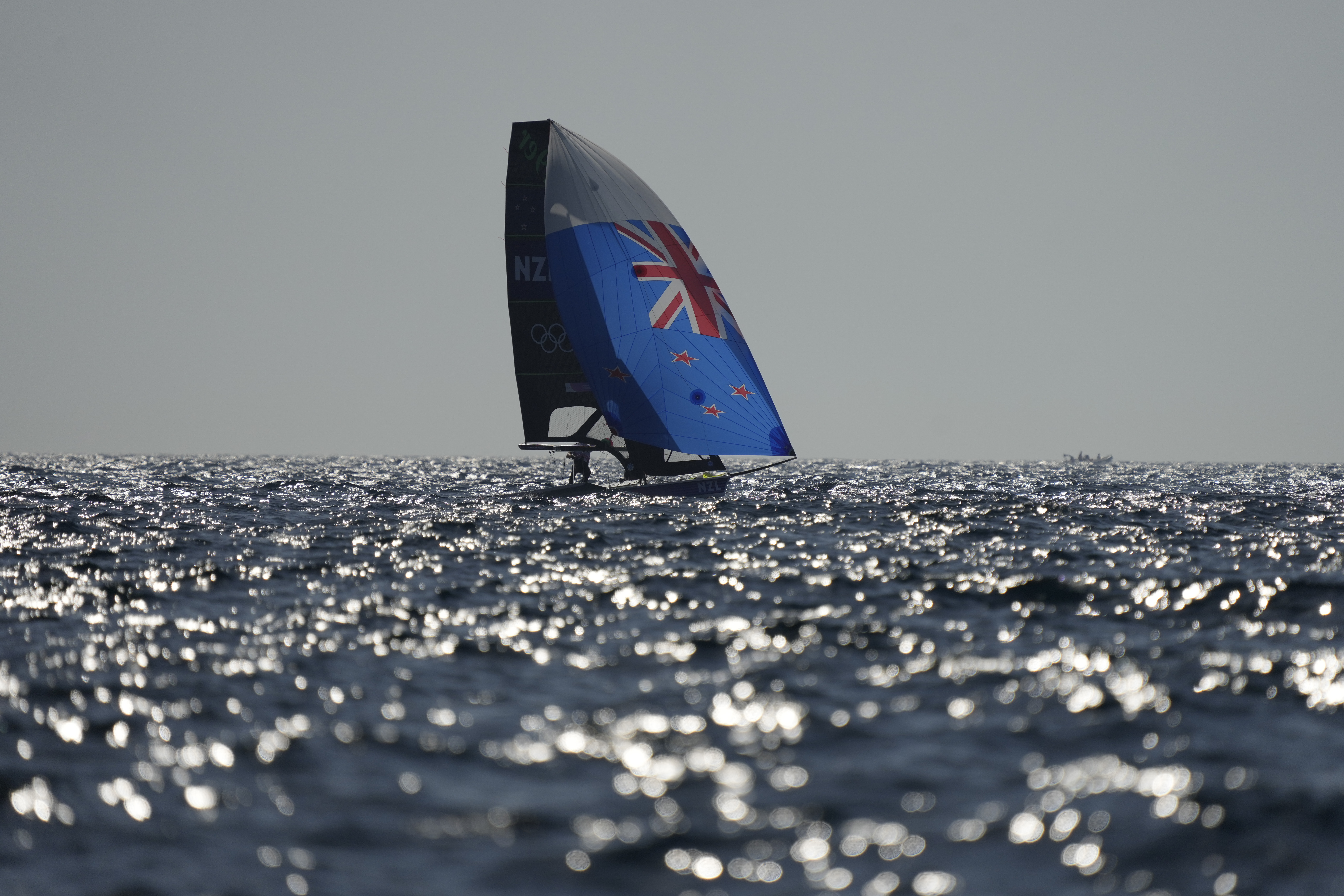 Isaac McHardie and William McKenzie of New Zealand sail before the men's skiff race was canceled due to the wind, during the 2024 Summer Olympics, Thursday, Aug. 1, 2024, in Marseille, France.