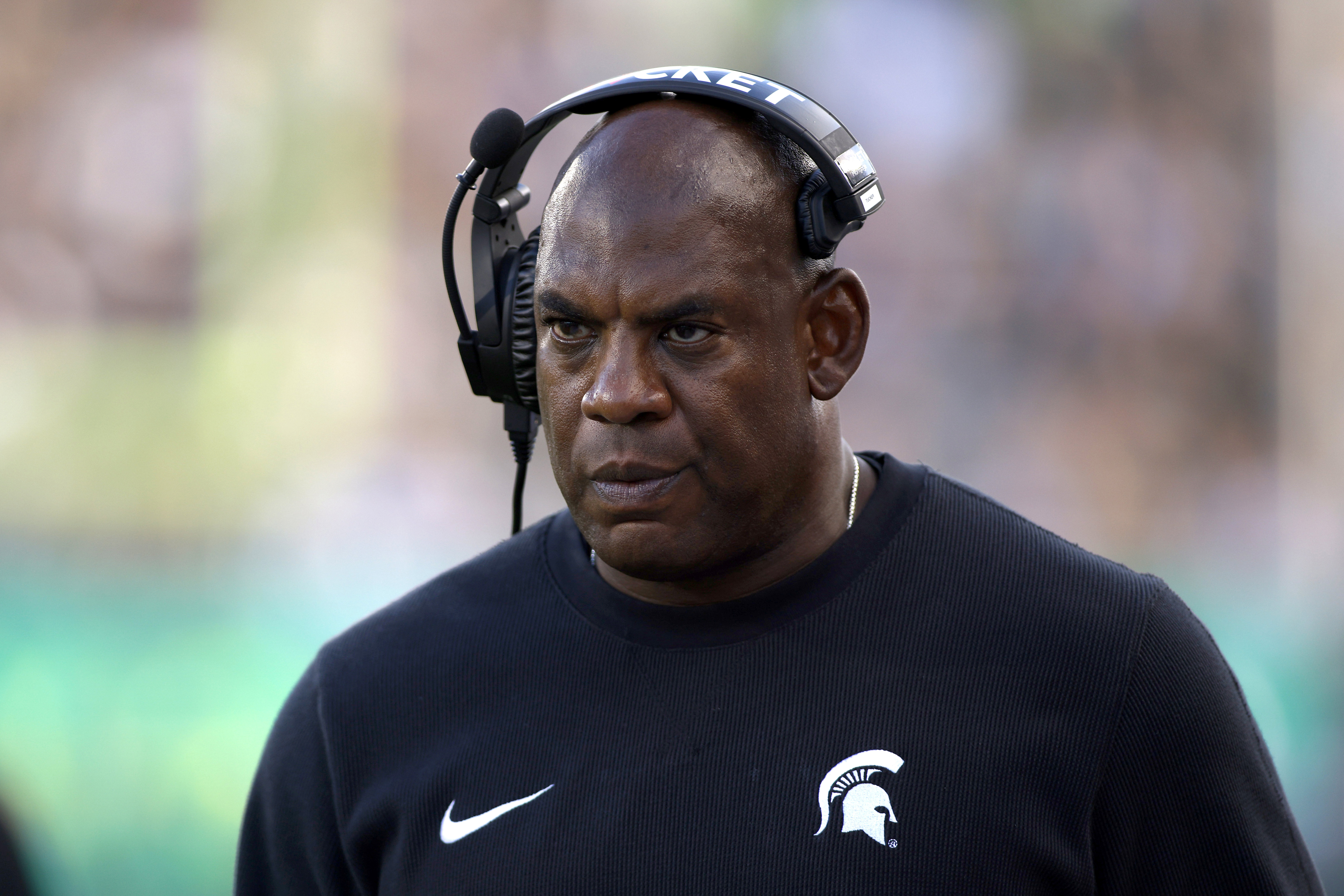 FILE - Michigan State coach Mel Tucker walks the sideline during the second half of an NCAA college football game against Richmond, on Sept. 9, 2023, in East Lansing, Mich. Former Michigan State University head football coach Mel Tucker is suing the university and school leaders, alleging that they wrongfully fired him last year and violated his constitutional rights amid a sexual harassment case. The federal lawsuit filed Wednesday, July 31, 2024, in Michigan accuses school officials of undertaking an “improper, sham investigation” of allegations that Tucker sexually harassed and exploited rape survivor and activist Brenda Tracy. 