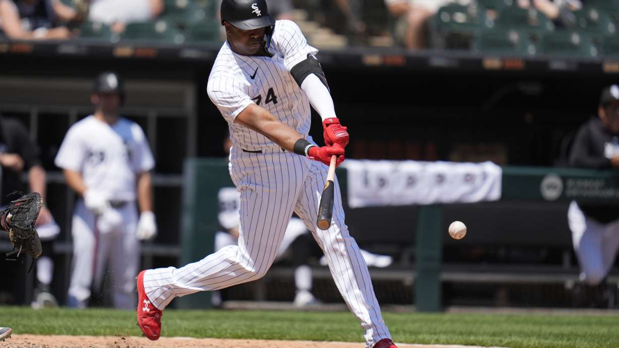 Chicago White Sox designated hitter Eloy Jiménez hits a single during the fifth inning of a baseball game against the Minnesota Twins, Wednesday, July 10, 2024, in Chicago.