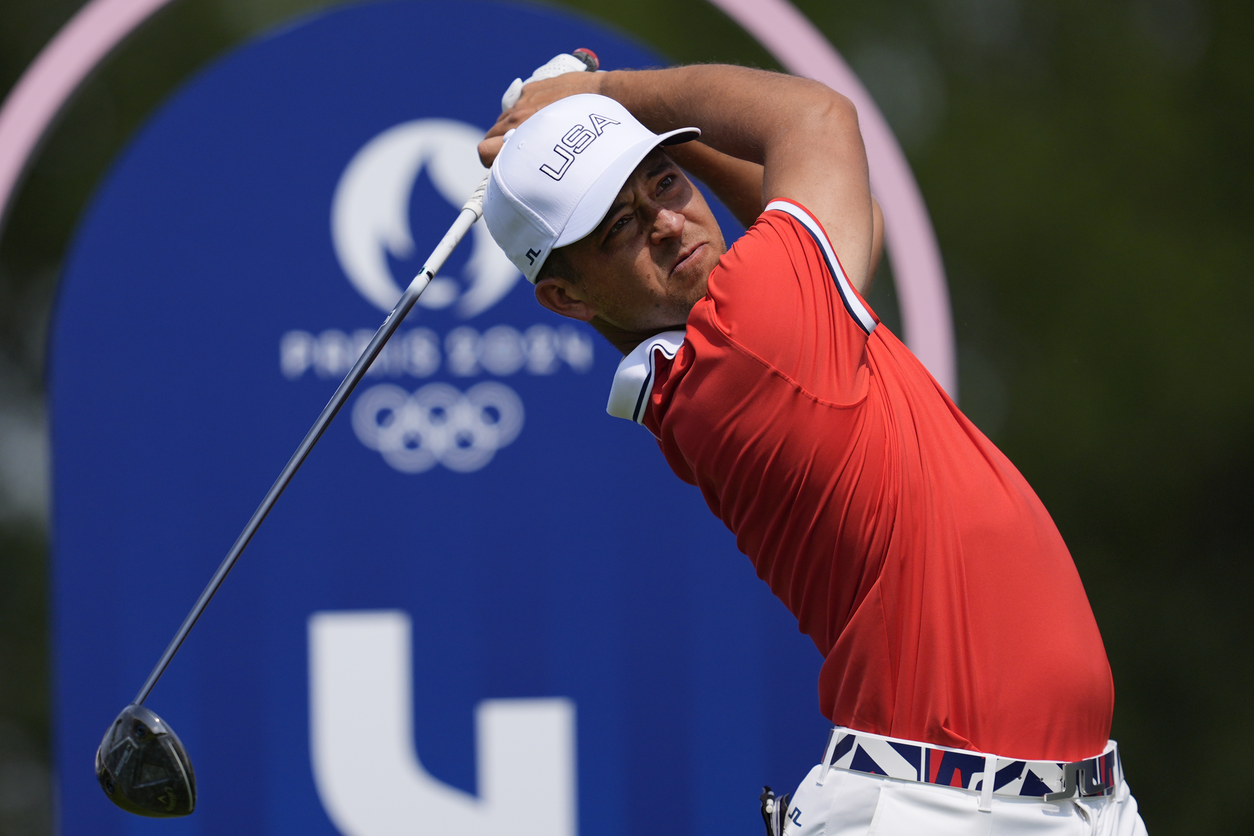 Xander Schauffele, of the United States, plays his tee shot on the 4th hole during the first round of the men's golf event at the 2024 Summer Olympics, Thursday, Aug. 1, 2024, at Le Golf National in Saint-Quentin-en-Yvelines, France. 