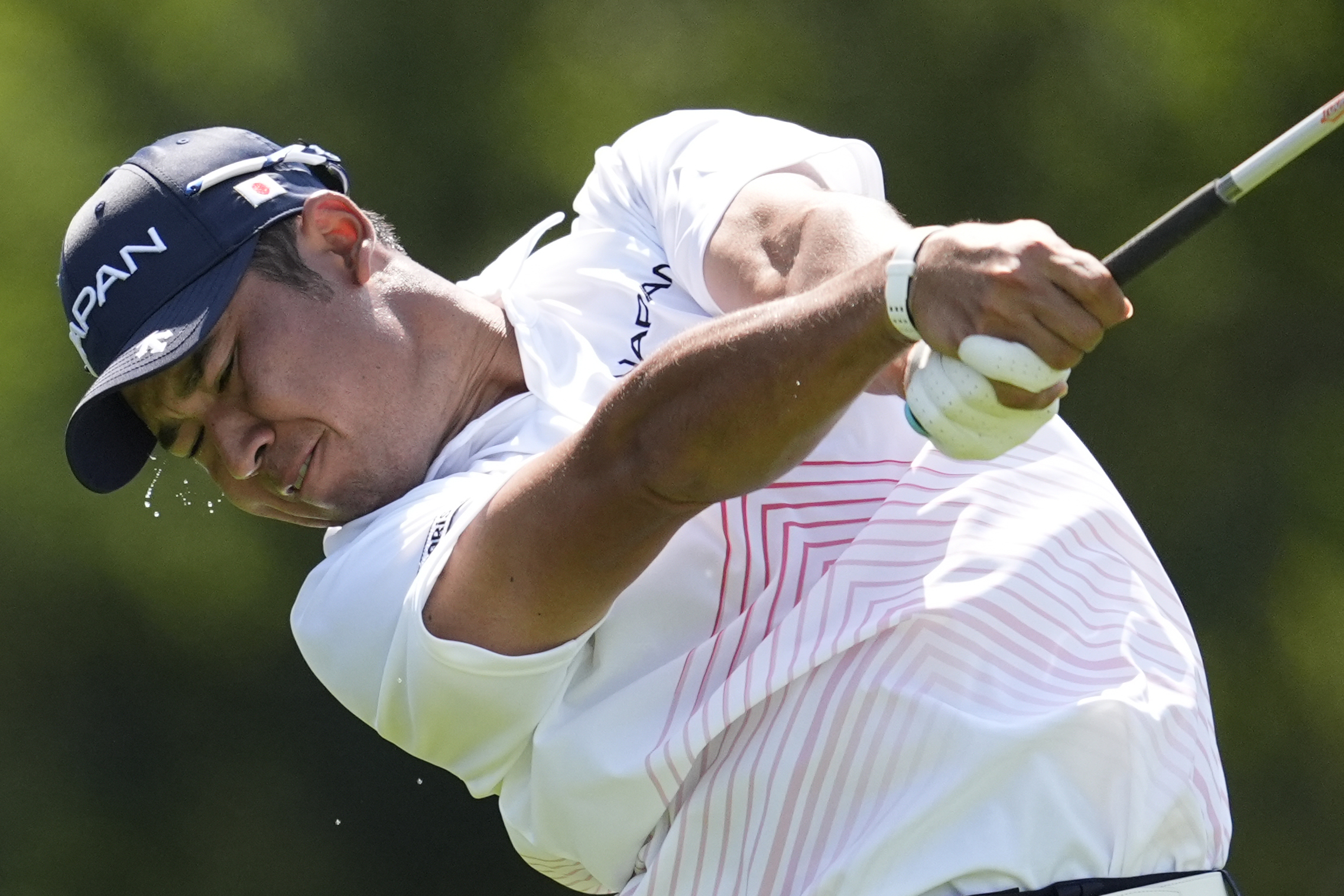 Hideki Matsuyama, of Japan, play his tee shot on the 14th hole during the first round of the men's golf event at the 2024 Summer Olympics, Thursday, Aug. 1, 2024, at Le Golf National in Saint-Quentin-en-Yvelines, France. 