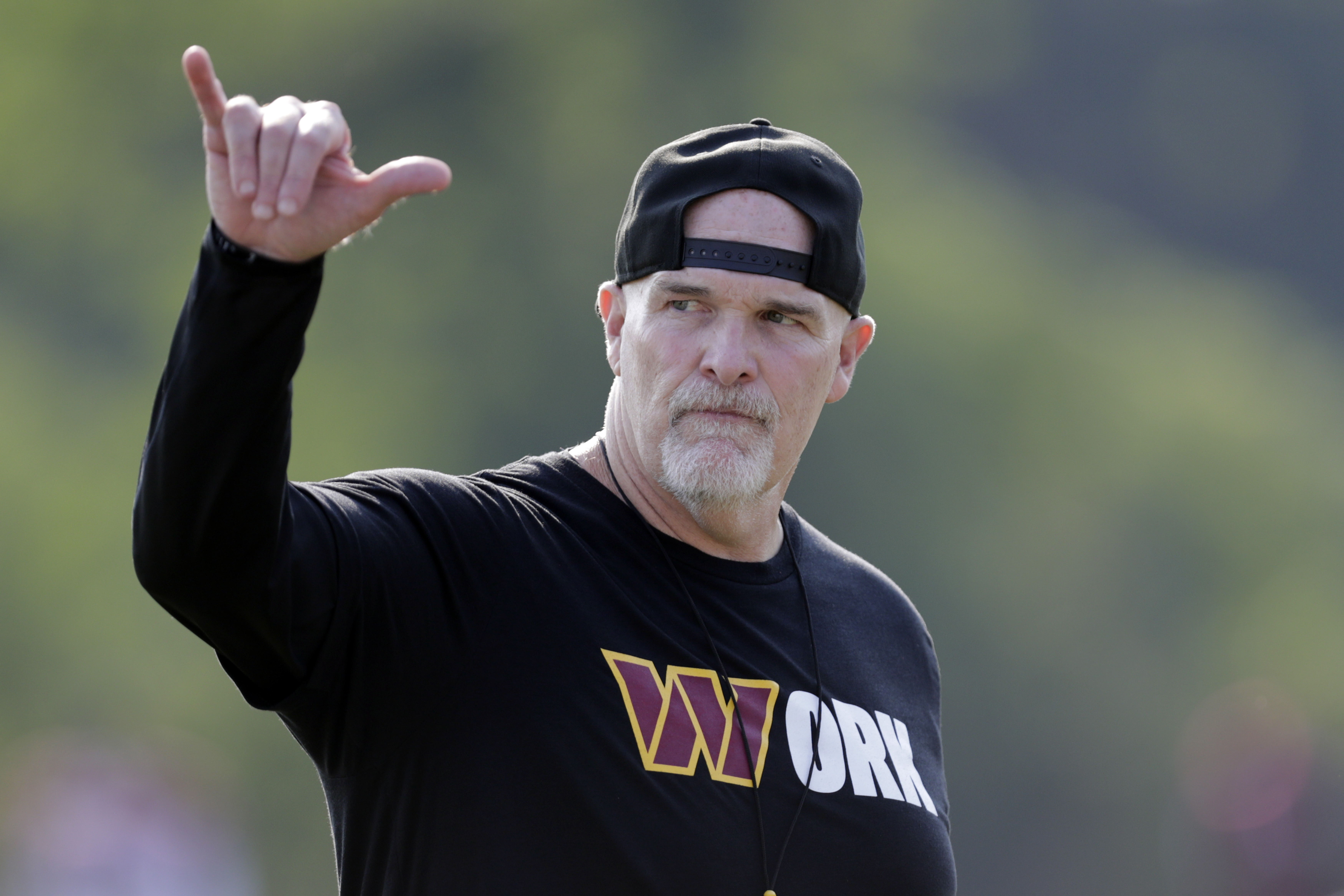 Washington Commanders head coach Dan Quinn gestures during NFL football practice at the team's training facility in Ashburn, Va., Thursday, Aug. 1, 2024. 