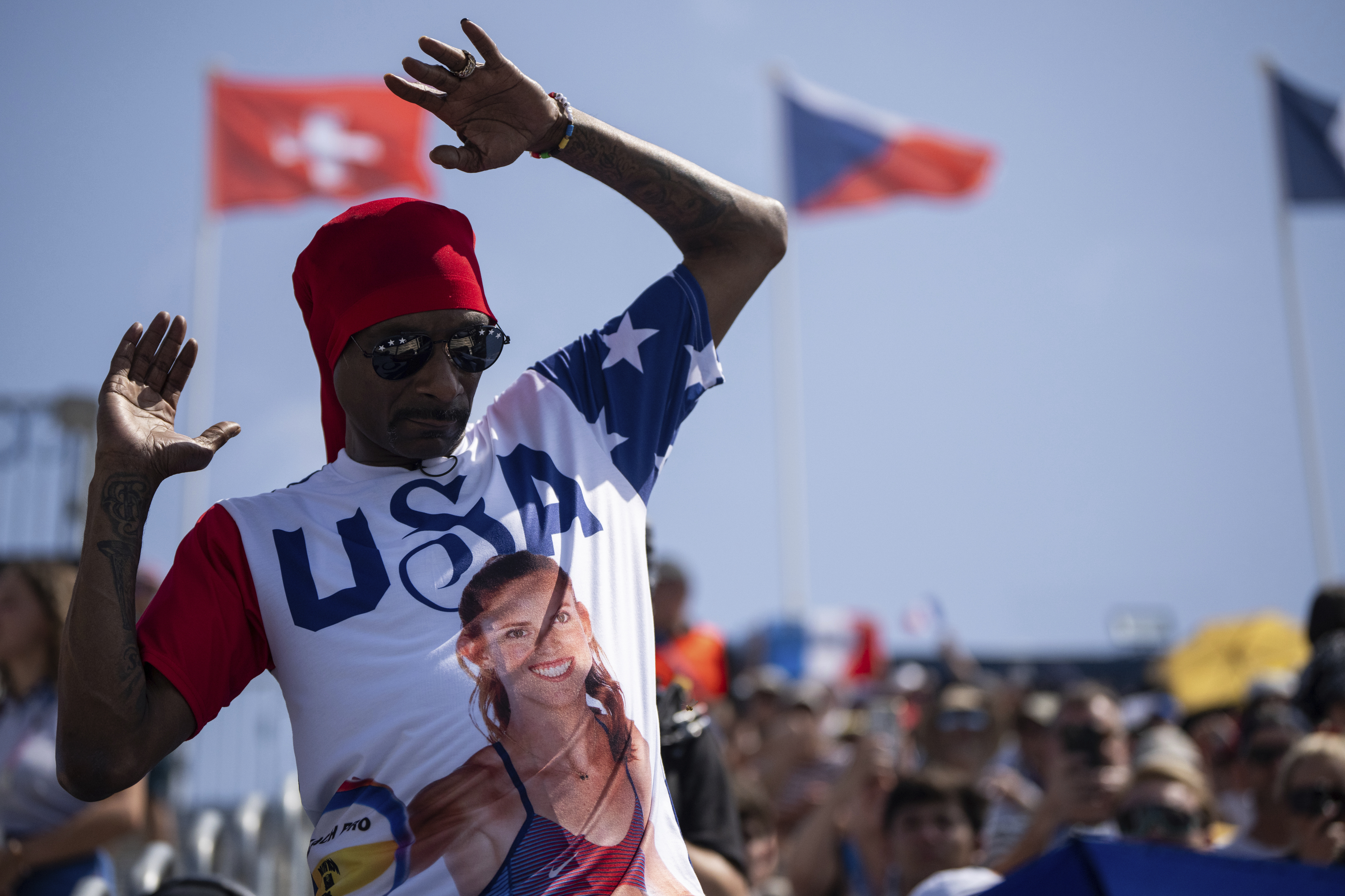 Snoop Dogg attends the women's pool C beach volleyball match between USA and France at Eiffel Tower Stadium at the 2024 Summer Olympics, Wednesday, July 31, 2024, in Paris, France. 