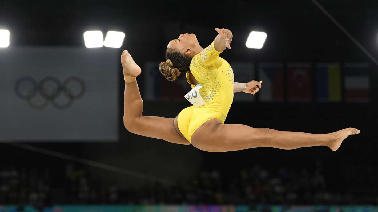 Rebeca Andrade, of Brazil, performs on the balance beam during the women's artistic gymnastics all-around finals in Bercy Arena at the 2024 Summer Olympics, Thursday, Aug. 1, 2024, in Paris, France.