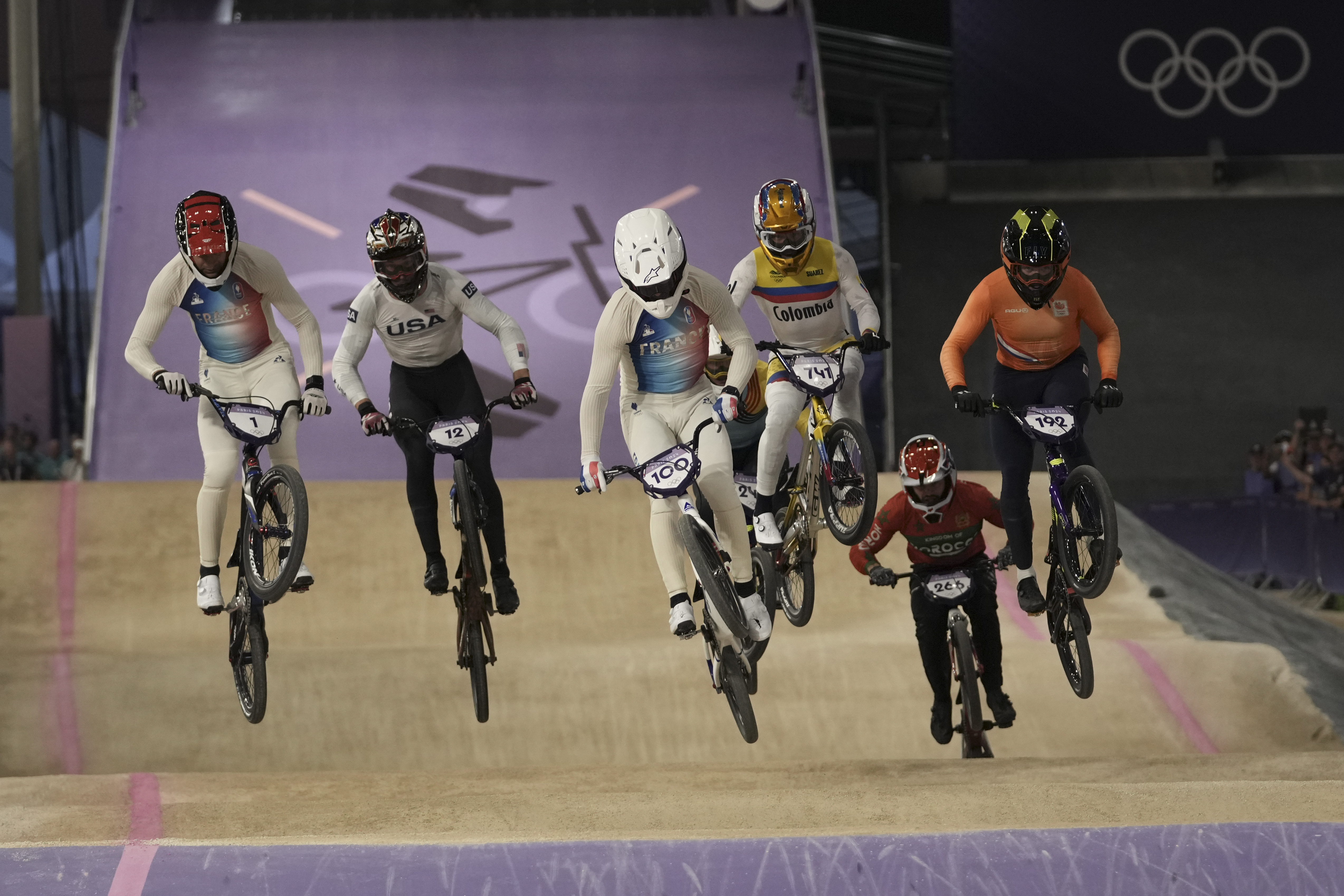 From left, Joris Daudet of France, Cameron Wood of The United States, Romain Mahieu of France, Diego Alejandro Arboleda Ospina of Colombia, Dean Reeves of Morocco and Dave van der Burg of the Netherlands compete in the men's BMX racing event, at the 2024 Summer Olympics, Thursday, Aug. 1, 2024, in Saint-Quentin-en-Yvelines, France. 
