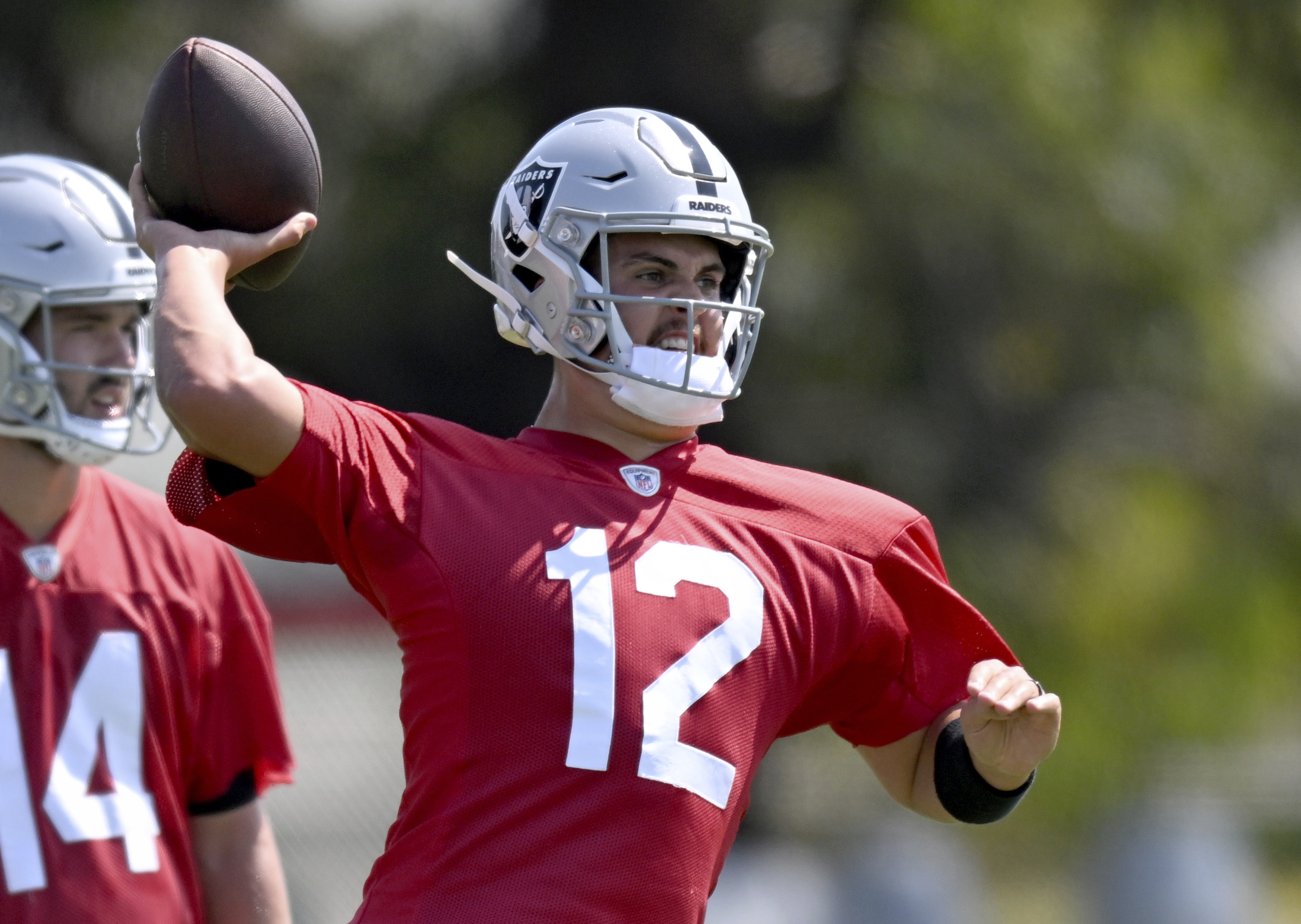 Las Vegas Raiders quarterback Aidan O'Connell works out during NFL football training camp, Thursday, July 25, 2024, in Costa Mesa, Calif. 