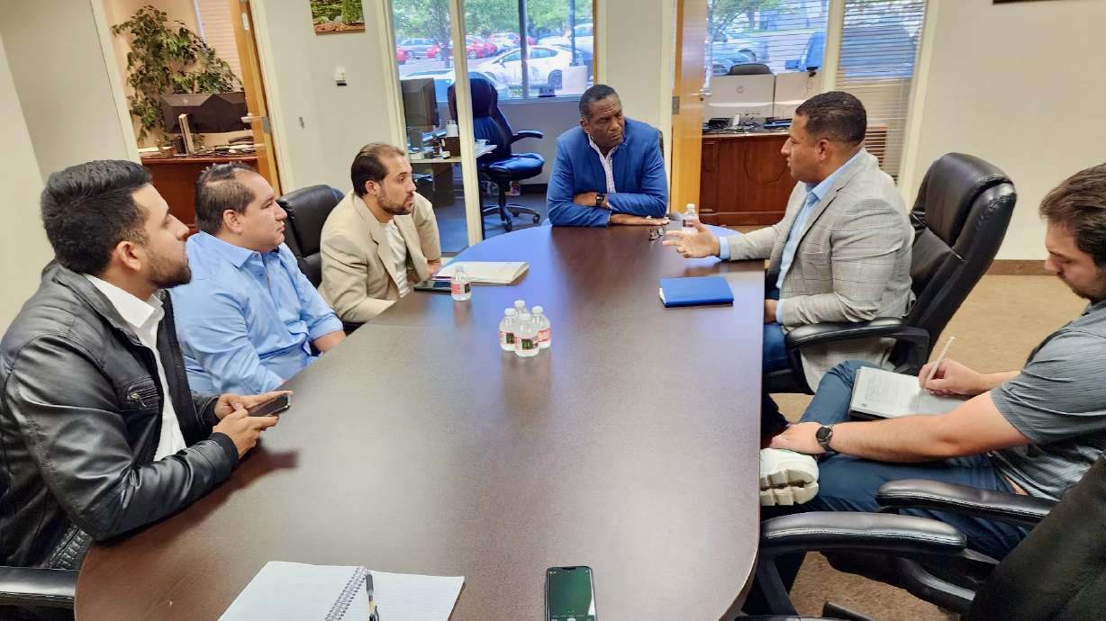 Rep. Burgess Owens, center, meeting Wednesday with members of Utah's Venezuelan community at his office in West Jordan about the recent presidential vote in the South American country. Second from right is Carlos Moreno, one of the Venezuelans.