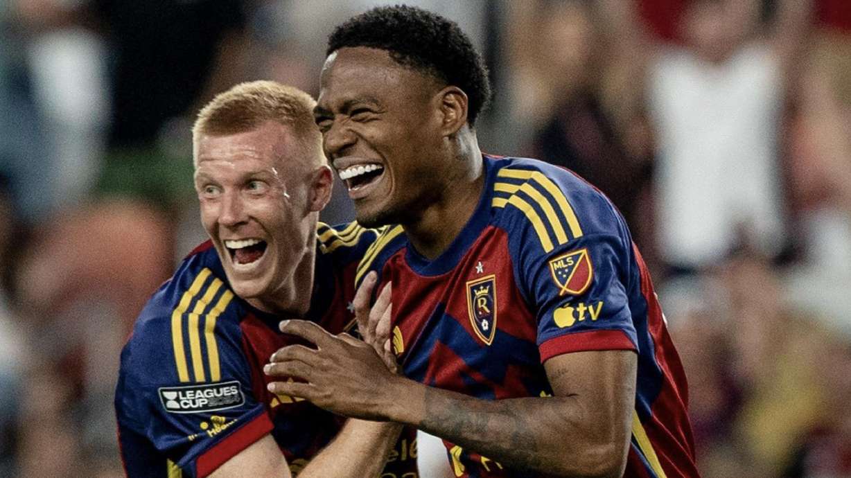 Justen Glad, left, and Nelson Palacio, right, celebrate Palacio's game-winning goal against Atlas.