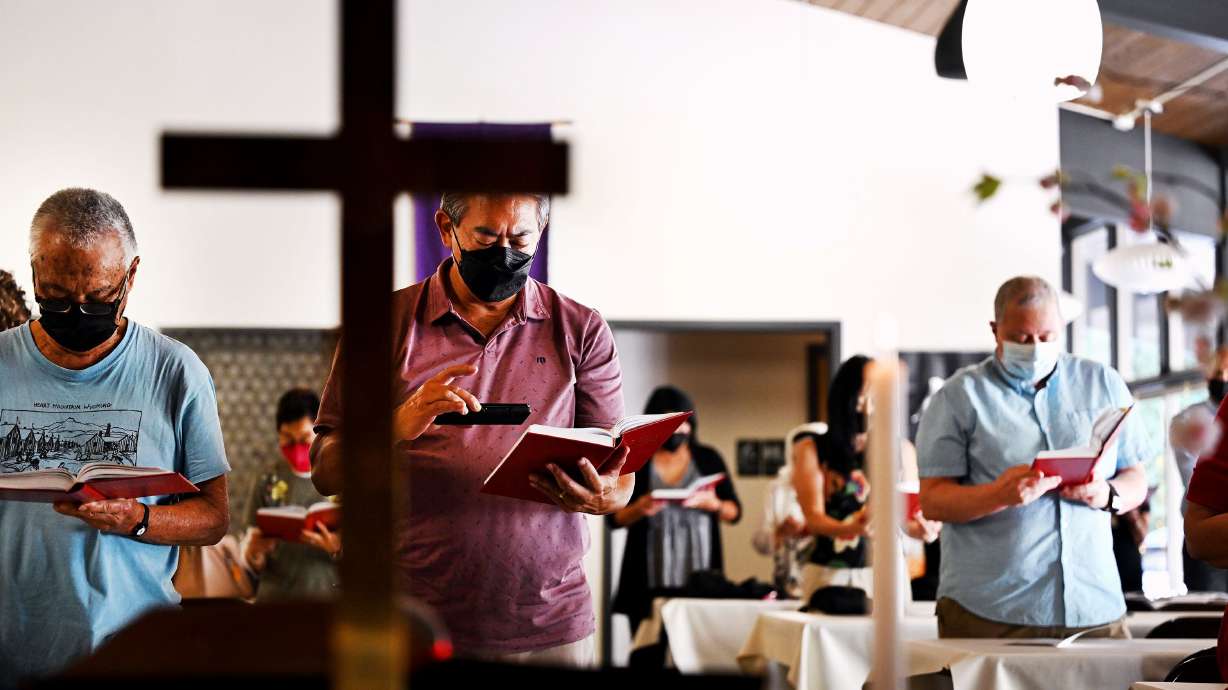 Members of the Japanese Church of Christ hold services on July 14. In the shadow of the massive Delta Center stands a century-old chapel as a testament to a mostly forgotten community.
