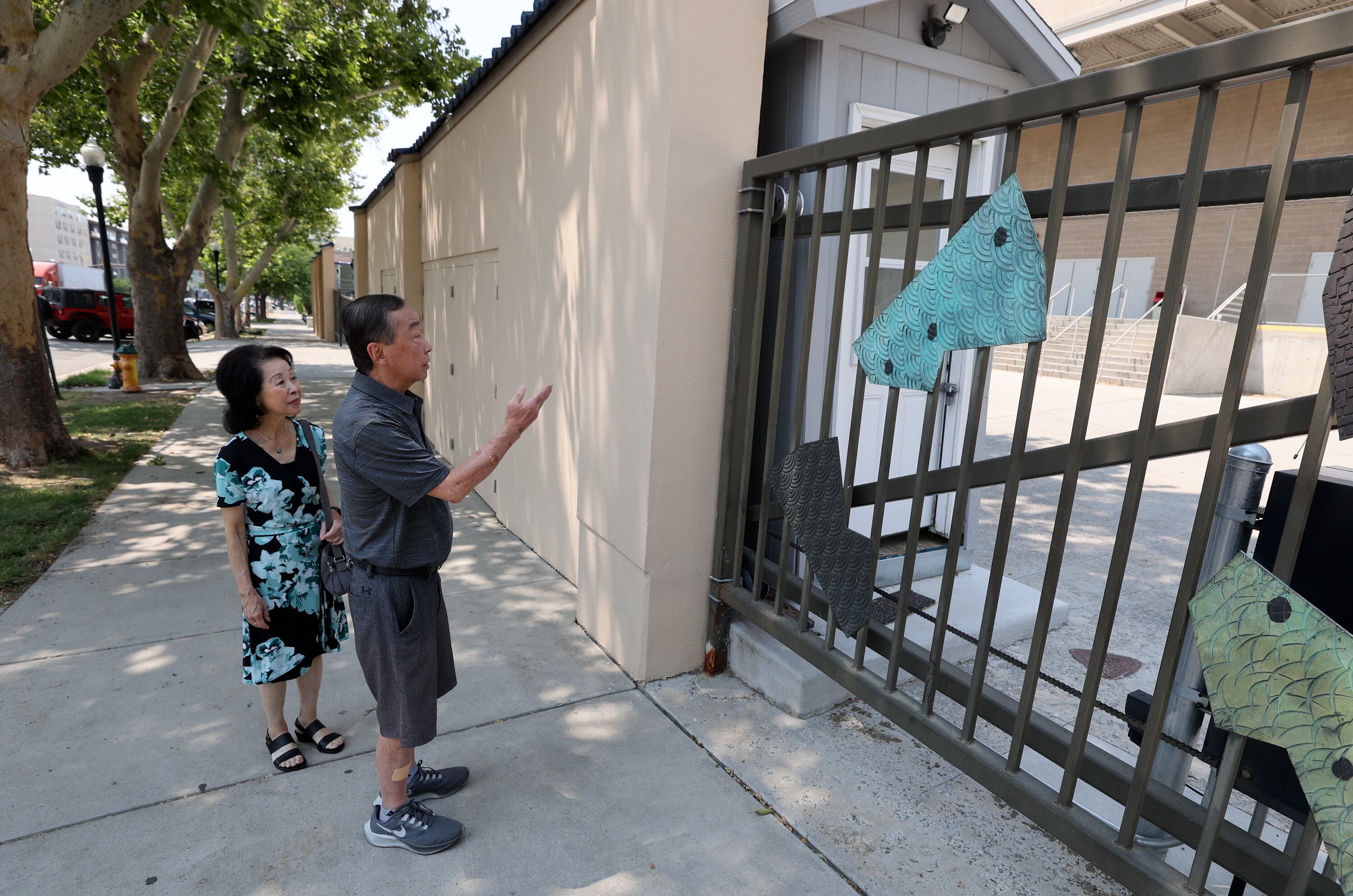 Sandy and Paul Iwasaki walk through Japantown, describing how it used to be when Paul grew up in the neighborhood, in Salt Lake City on Monday, July 22, 2024. Sandy frequented the area growing up.