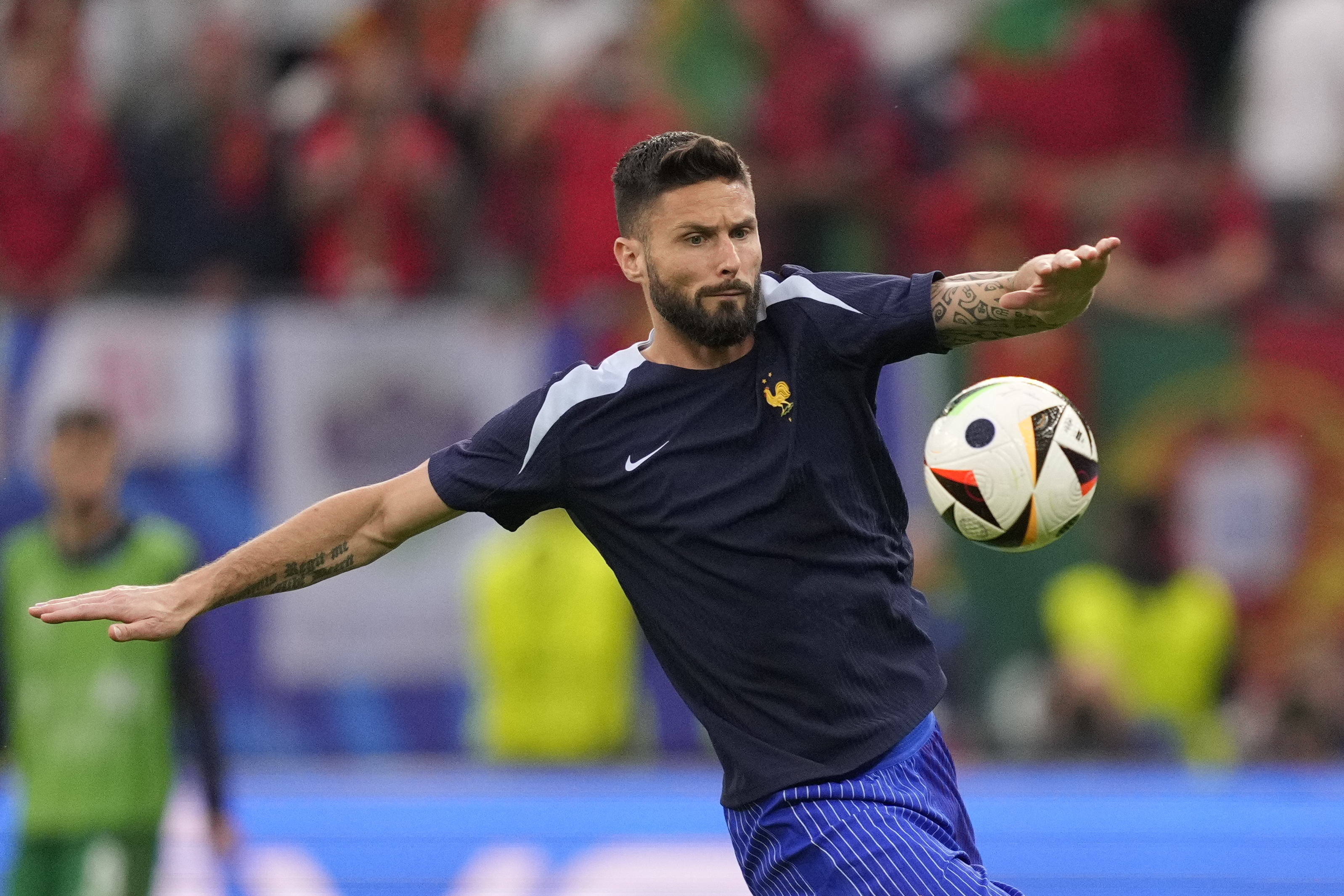 Olivier Giroud of France warms up ahead of a quarter final match between Portugal and France at the Euro 2024 soccer tournament in Hamburg, Germany, Friday, July 5, 2024. 