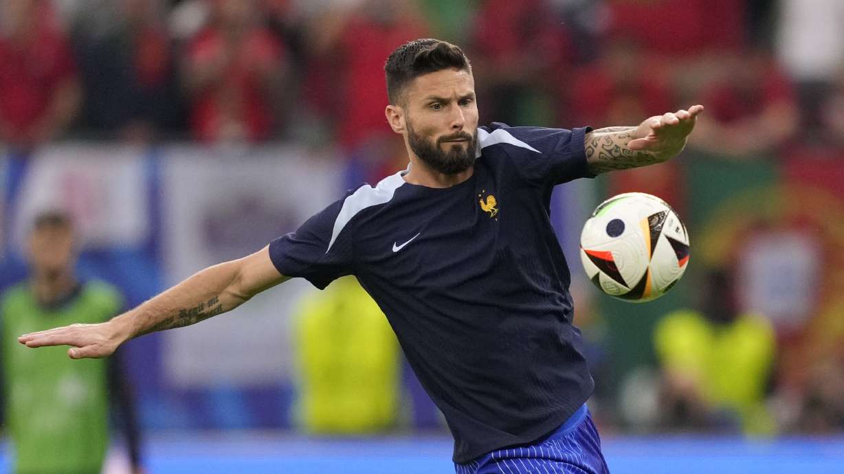 Olivier Giroud of France warms up ahead of a quarter final match between Portugal and France at the Euro 2024 soccer tournament in Hamburg, Germany, Friday, July 5, 2024.