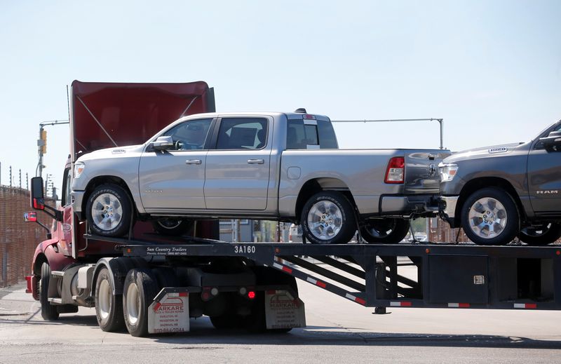 A hauler transports Dodge Ram pick-up trucks to a holding lot from the FCA Jefferson North Assembly Plant in Detroit, Michigan, May 25, 2018. Dodge SUVs have come under scrutiny for lock failure.