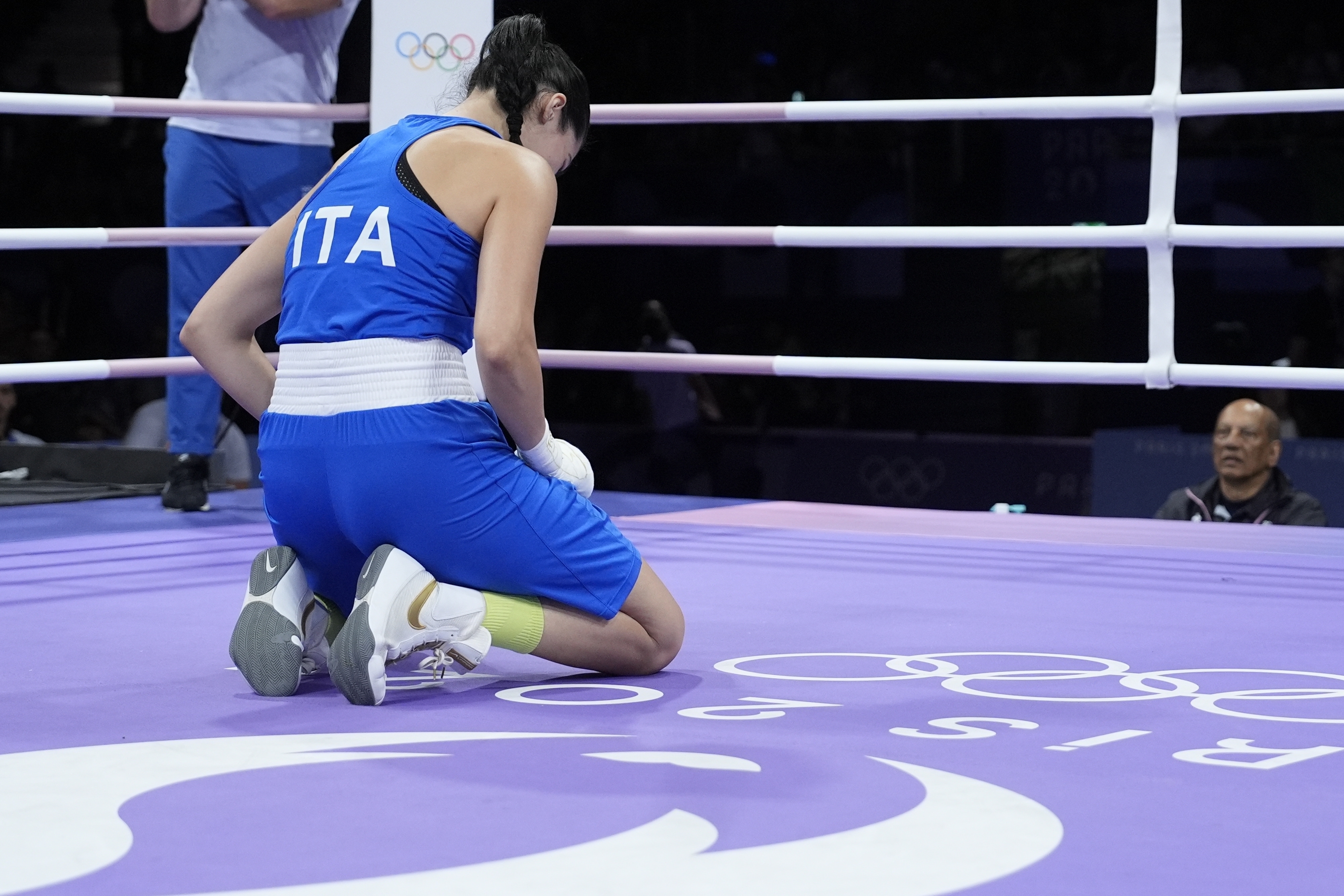 Italy's Angela Carini reacts after she was defeating by Algeria's Imane Khelif, in their women's 66kg preliminary boxing match at the 2024 Summer Olympics, Thursday, Aug. 1, 2024, in Paris, France.