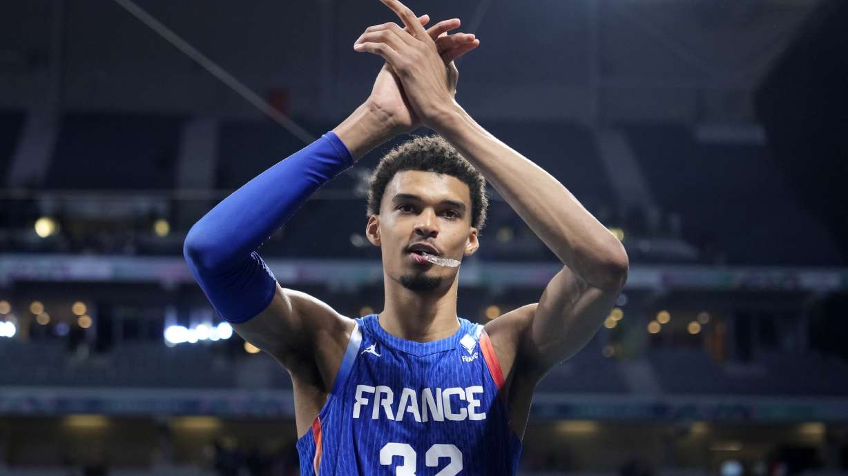 France's Victor Wembanyama claps as he leaves the court after France defeated Japan in a men's basketball game at the 2024 Summer Olympics, Tuesday, July 30, 2024, in Villeneuve-d'Ascq, France.
